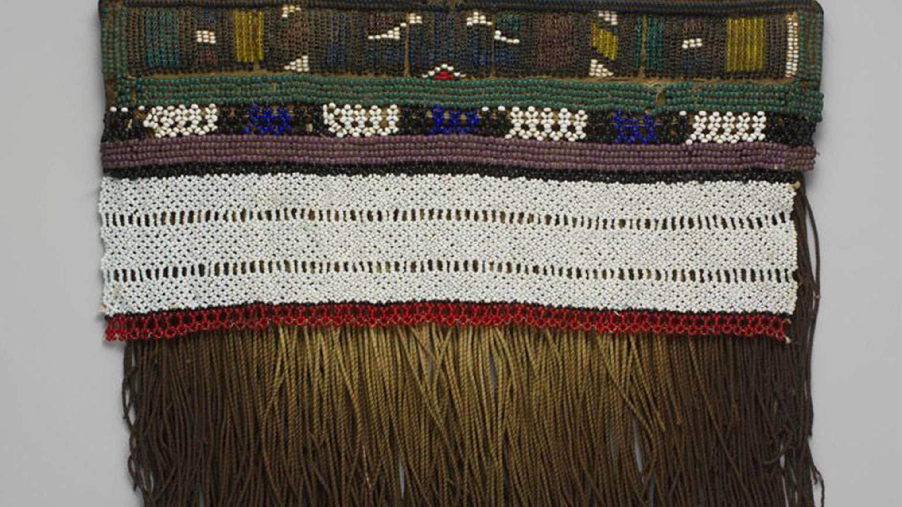 Detail view of a girl's apron made glass beads and hide