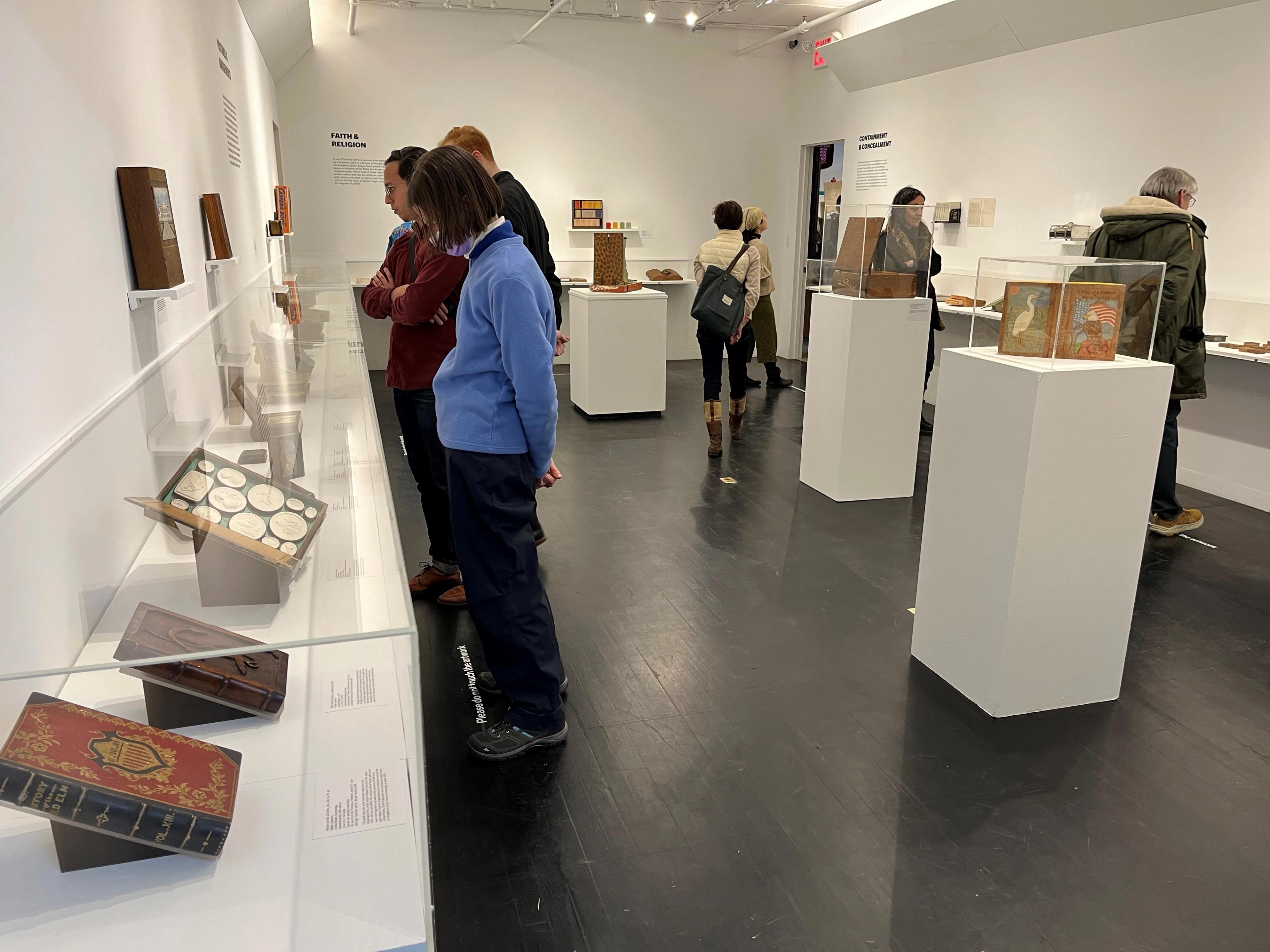 People viewing "blooks" in an exhibition