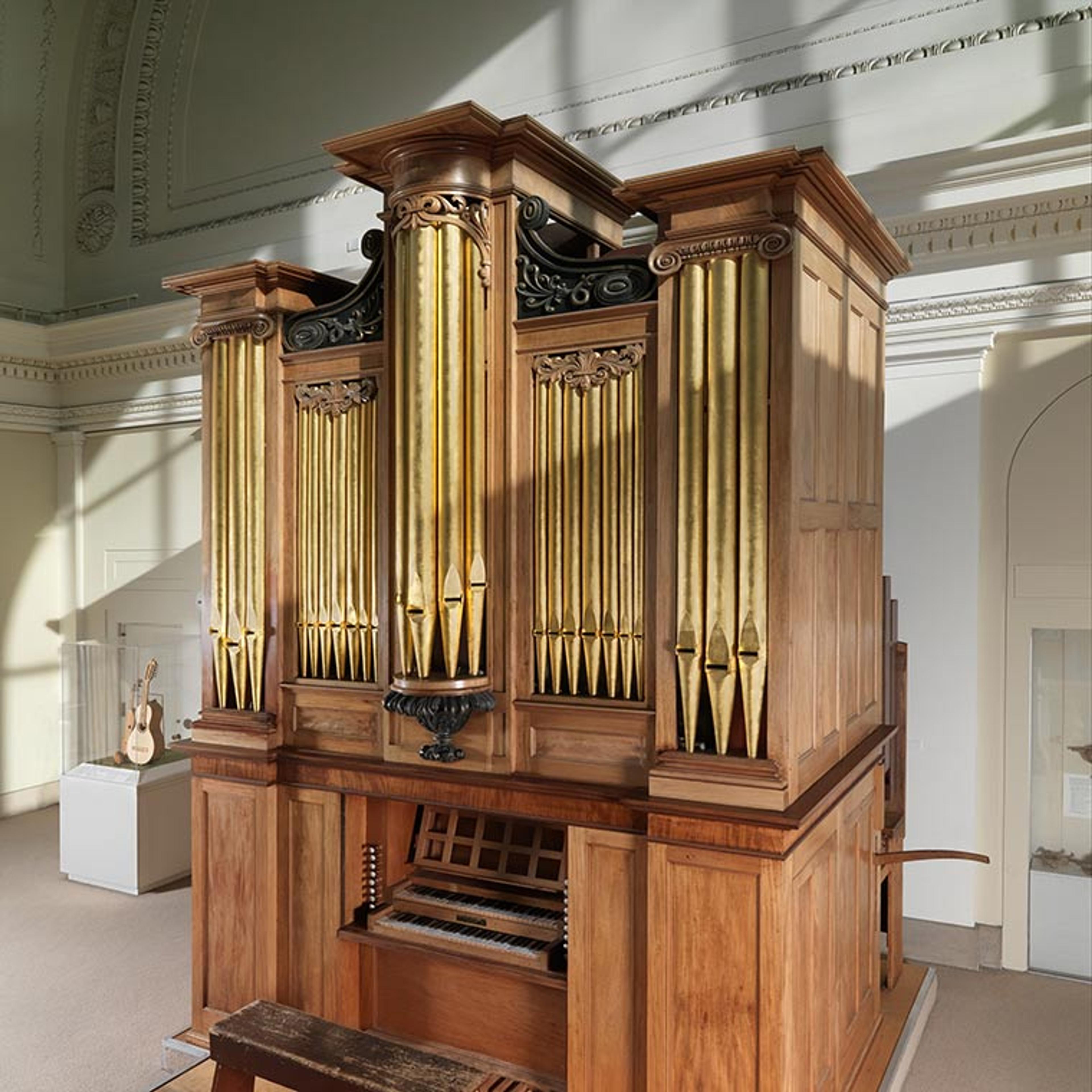 The Met's Appleton organ on the organ loft in raking sunlight.