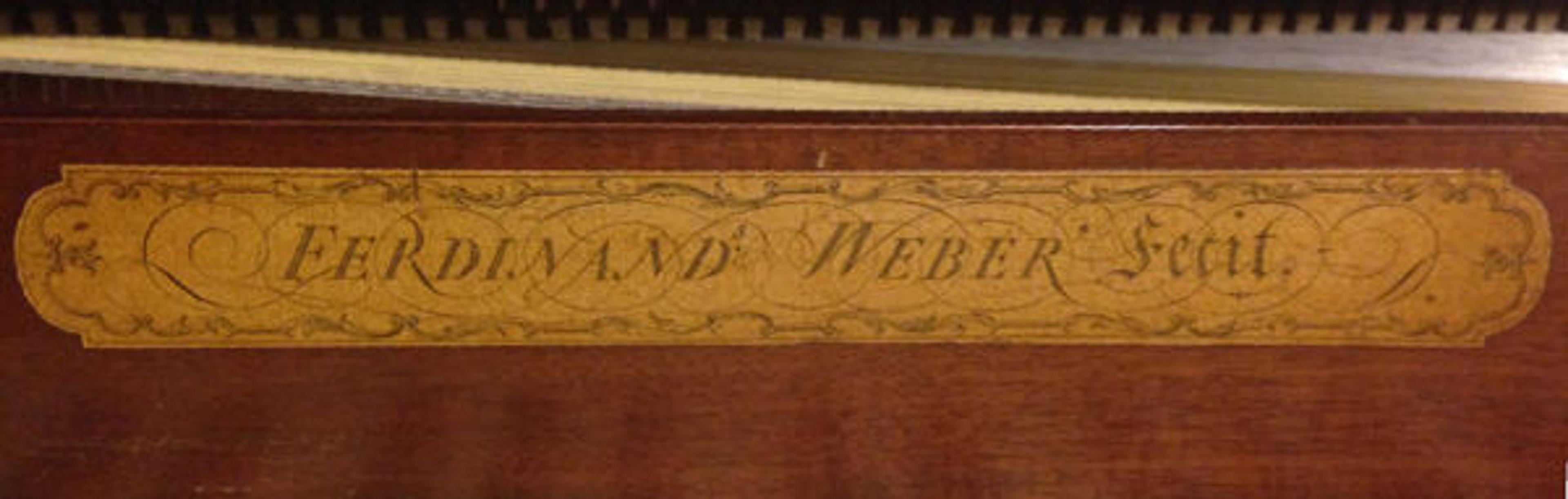 The piano's name board, showing Weber's mark