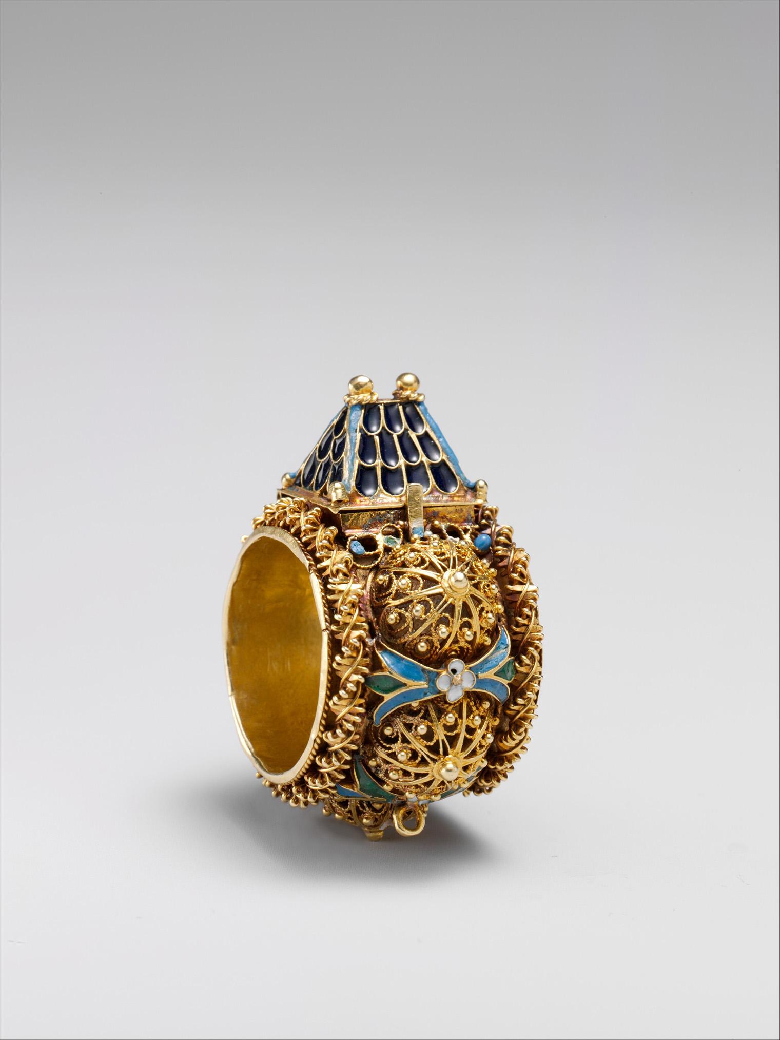 Ornate gold ring with blue enamel dome