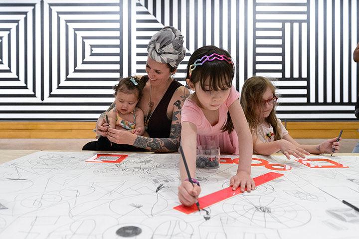 Family at drawing table