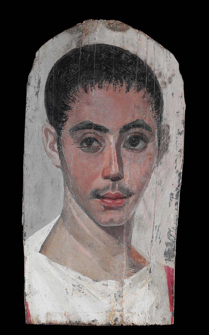 A portrait of a young man with a scar on his right eye