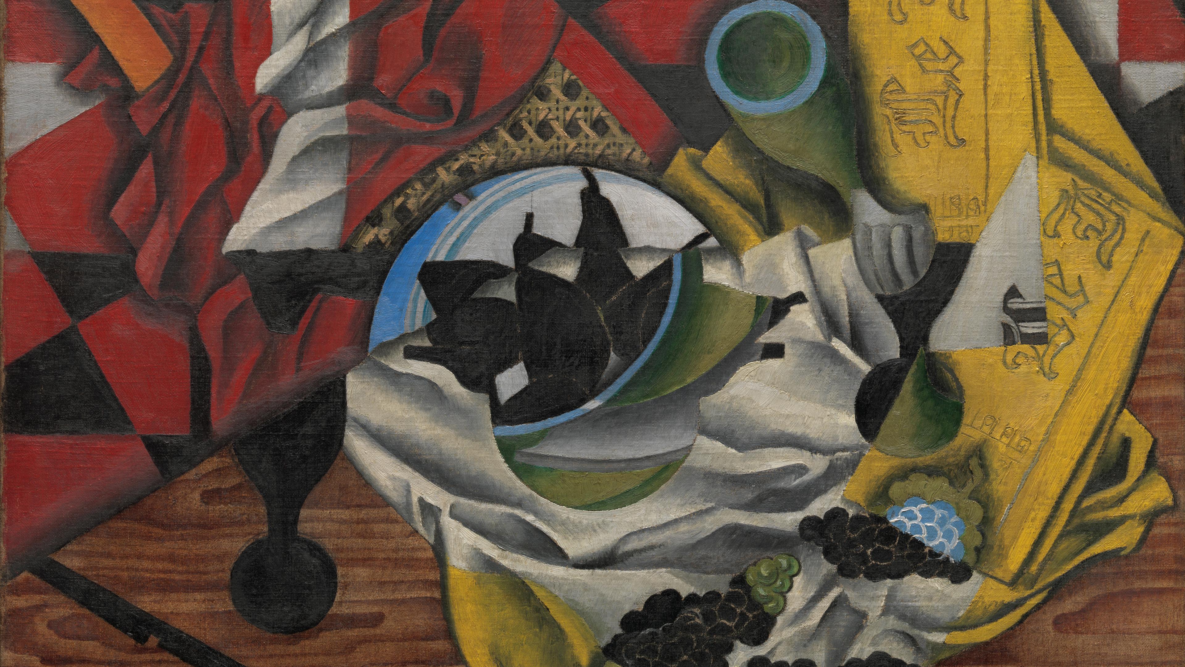 Red and yellow oil painting of a table hastily left with pears, grapes, a knife and crumpled napkin on it called "Pears and Grapes on a Table" by Juan Gris.
