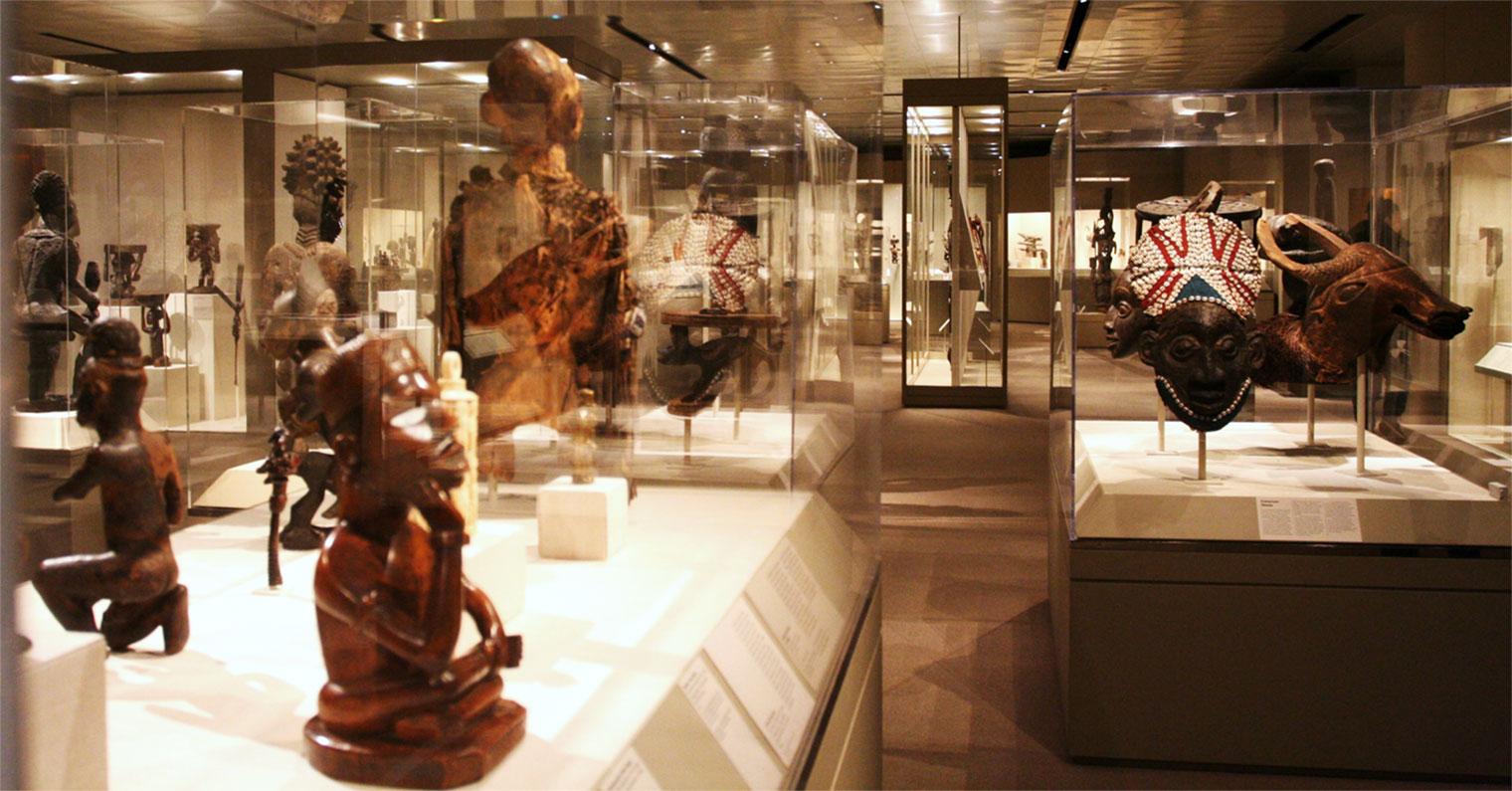 View of African art gallery showing objects in glass display cases