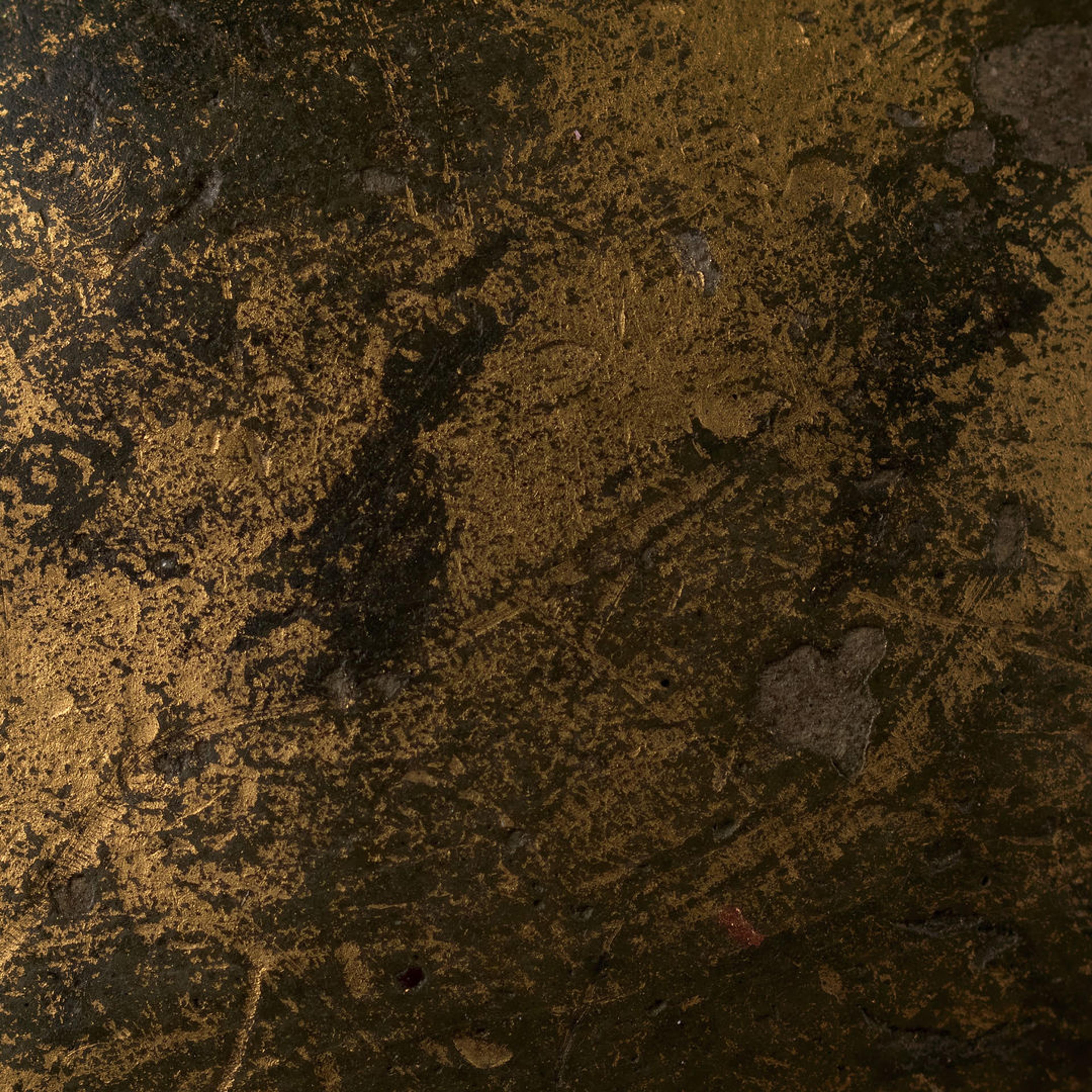 A metallic black and gold texture