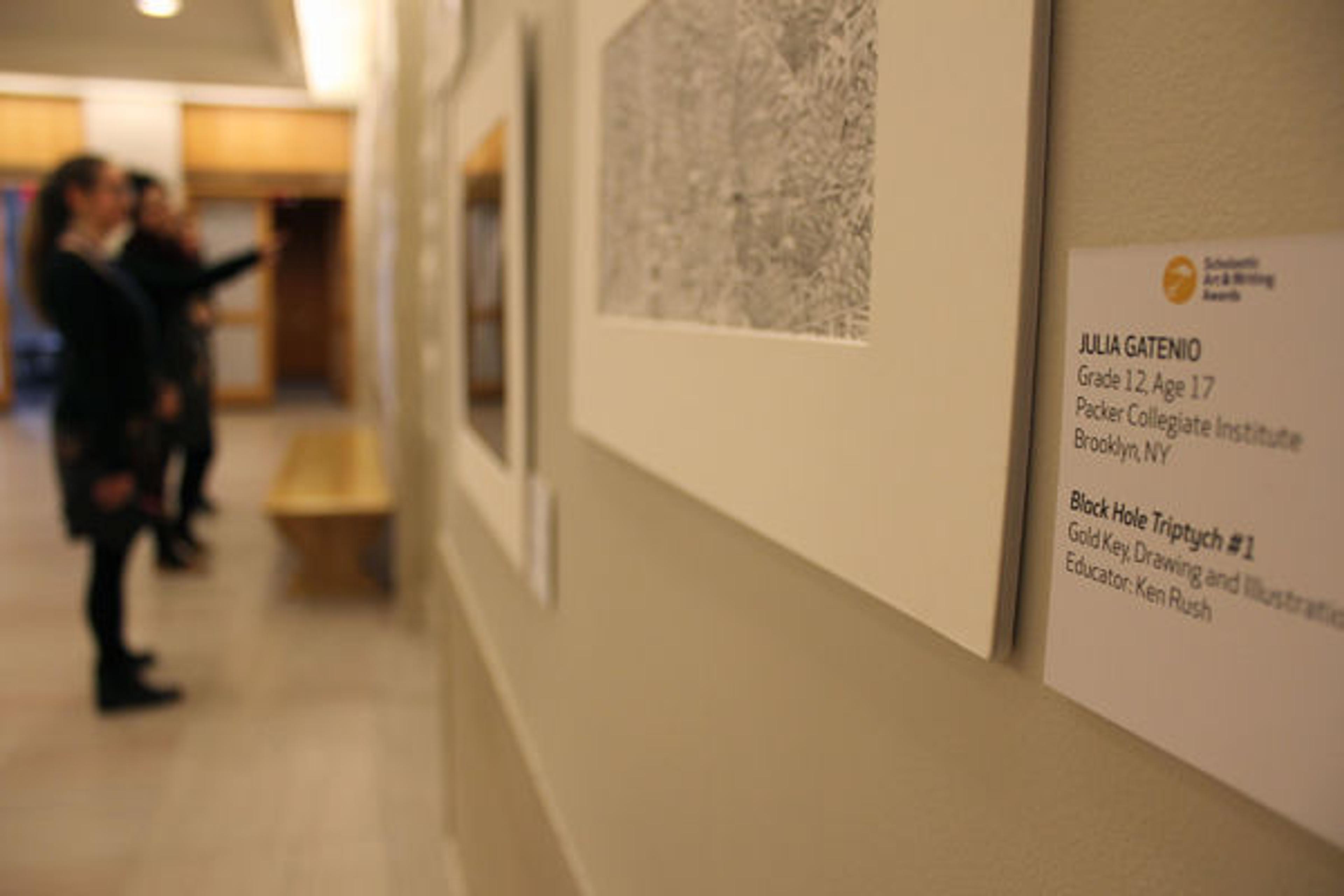 Close-up of artwork credits in the 2015 NYC Scholastic Awards Exhibition in the Ruth and Harold D. Uris Center for Education. Photograph by Ariel Greene