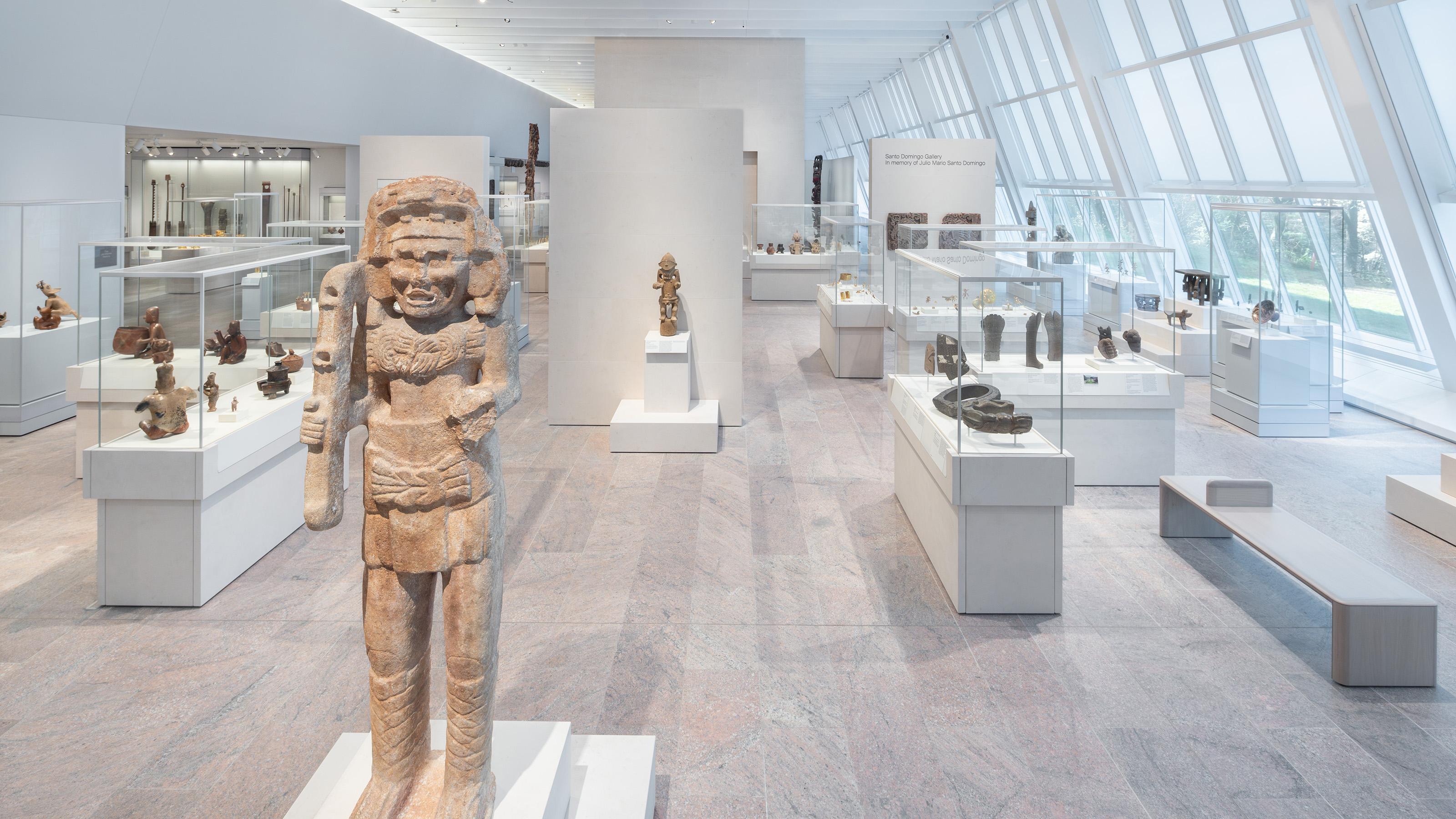 A long gallery with stone and metal objects