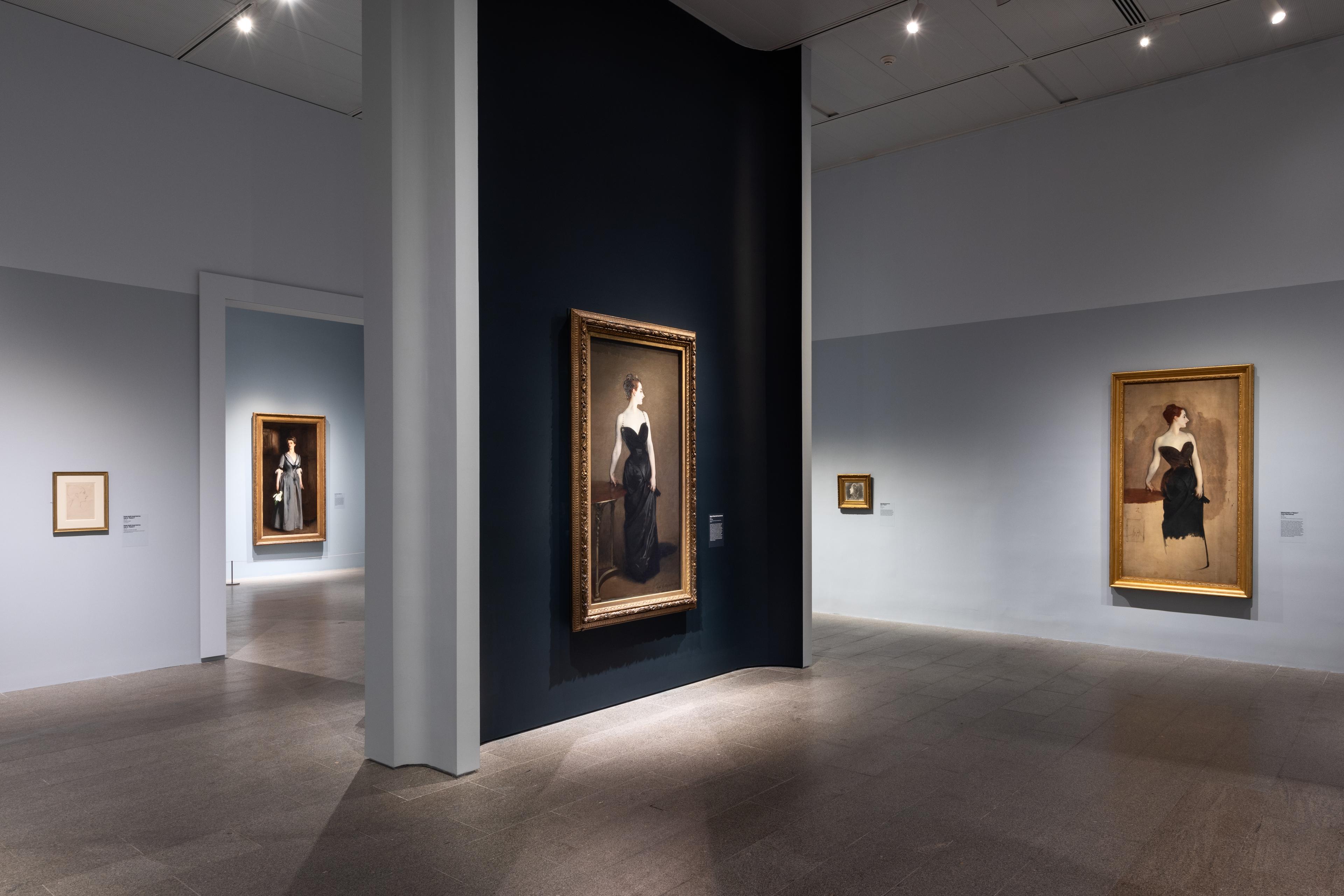 Large gallery view angled towards a single image of a madam in a black dress