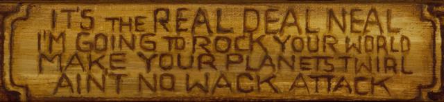 Plaque reading “It’s the real deal Neal / I’m going to rock your world / Make your planets twirl / Ain‘t no wack attack”