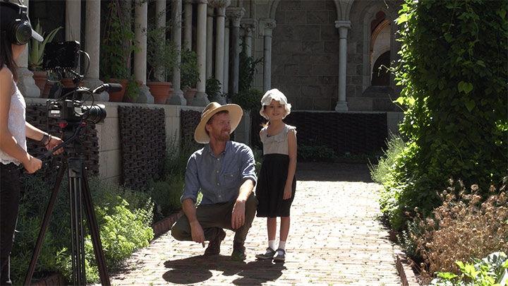 Caleb and Ella being filmed at The Cloisters