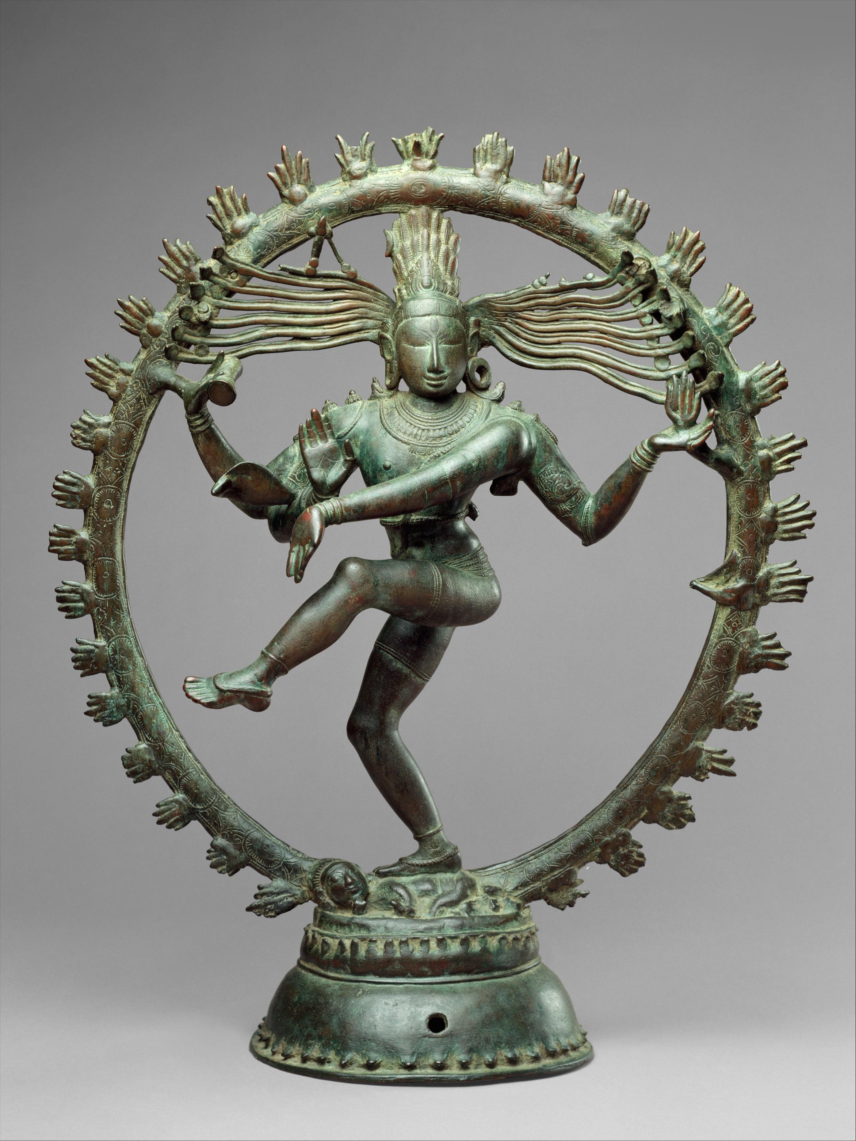 Bronze sculpture of Shiva as Lord of Dance, dancing within a ring of flames, one leg raised and multiple arms extended in dynamic motion.