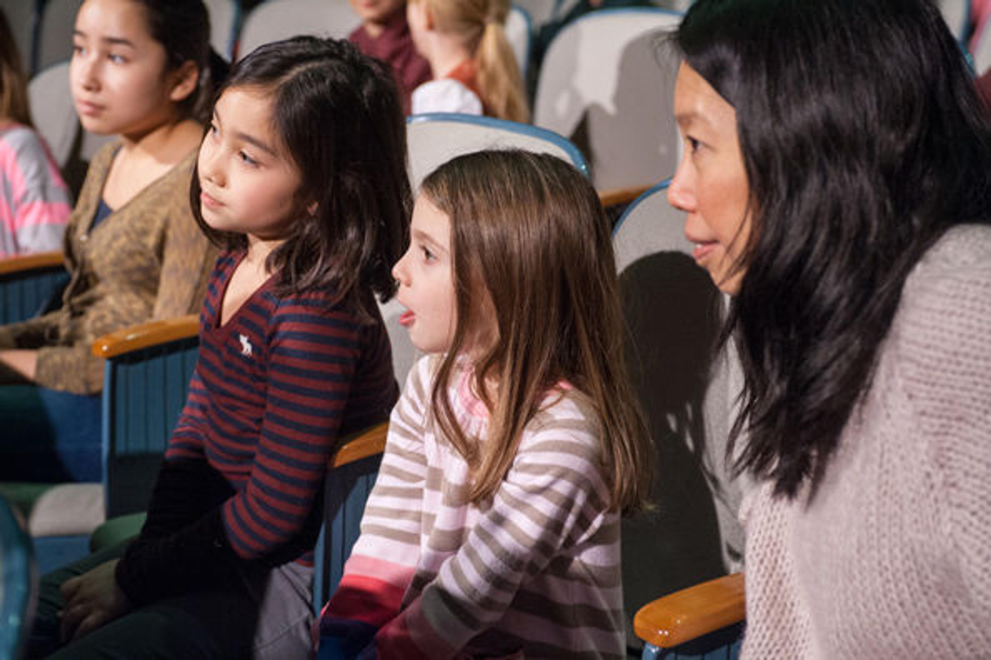 Children watching a Met Museum performance