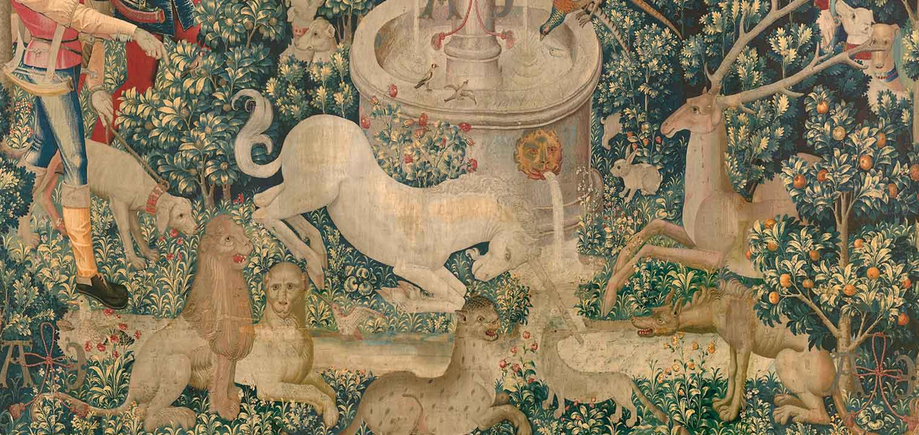 In this detail of a  medieval tapestry, a unicorn dips its horn into a stream beneath a fountain. It is surrounded by animals to its left and right.