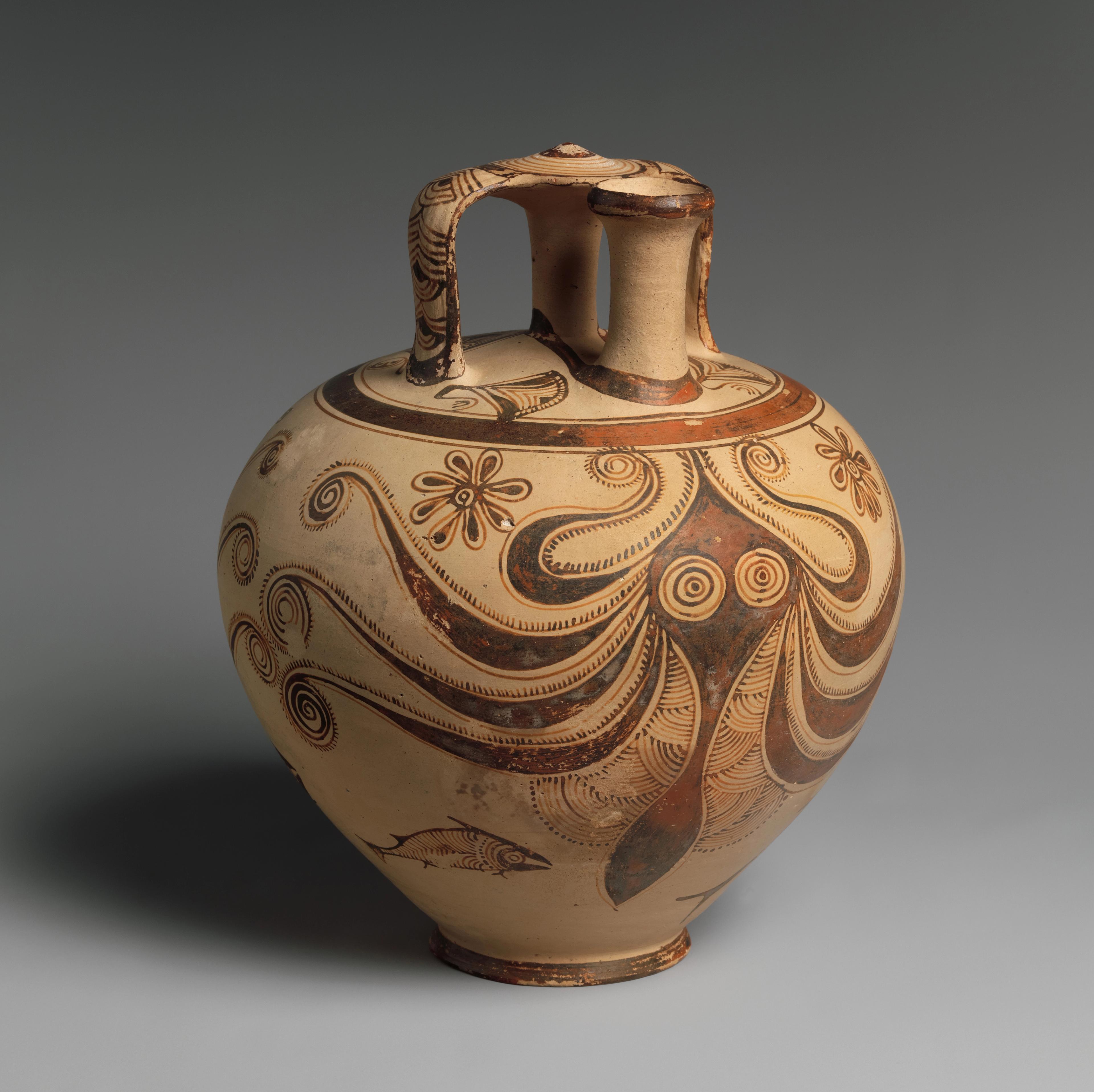 A rounded ceramic jar decorated with floral and marine motifs. An octopus design wraps around the surface.