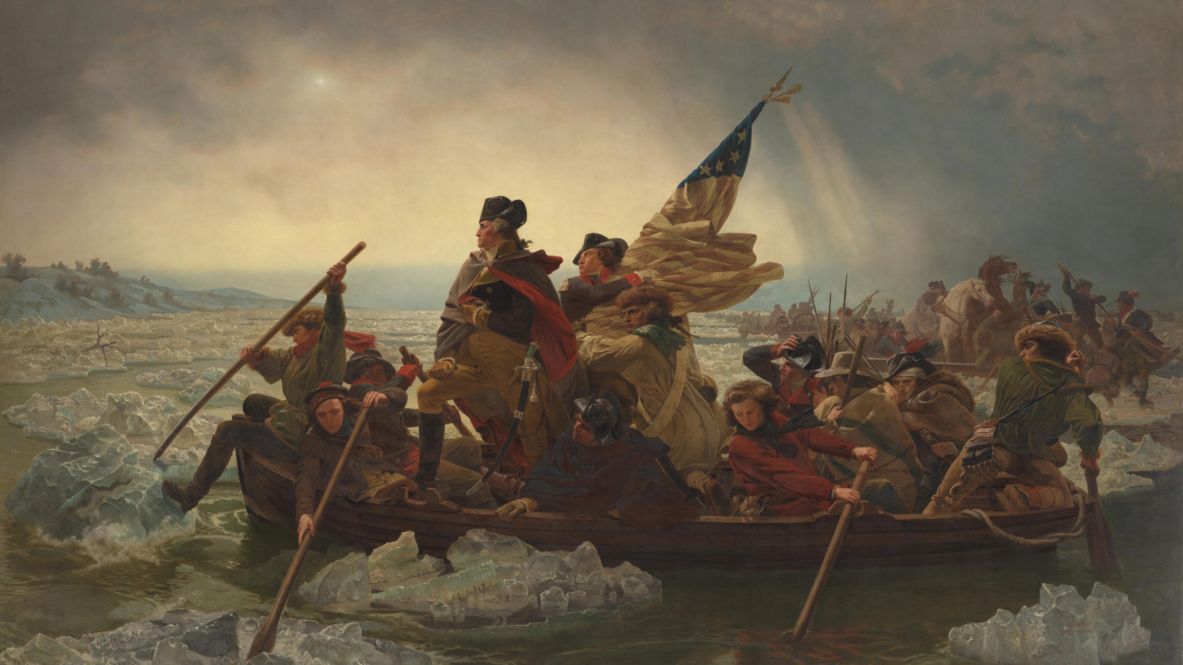 George Washington stands at the bow of a boat as soldiers row across an icy Delaware River under a cloudy sky during the Revolutionary War.