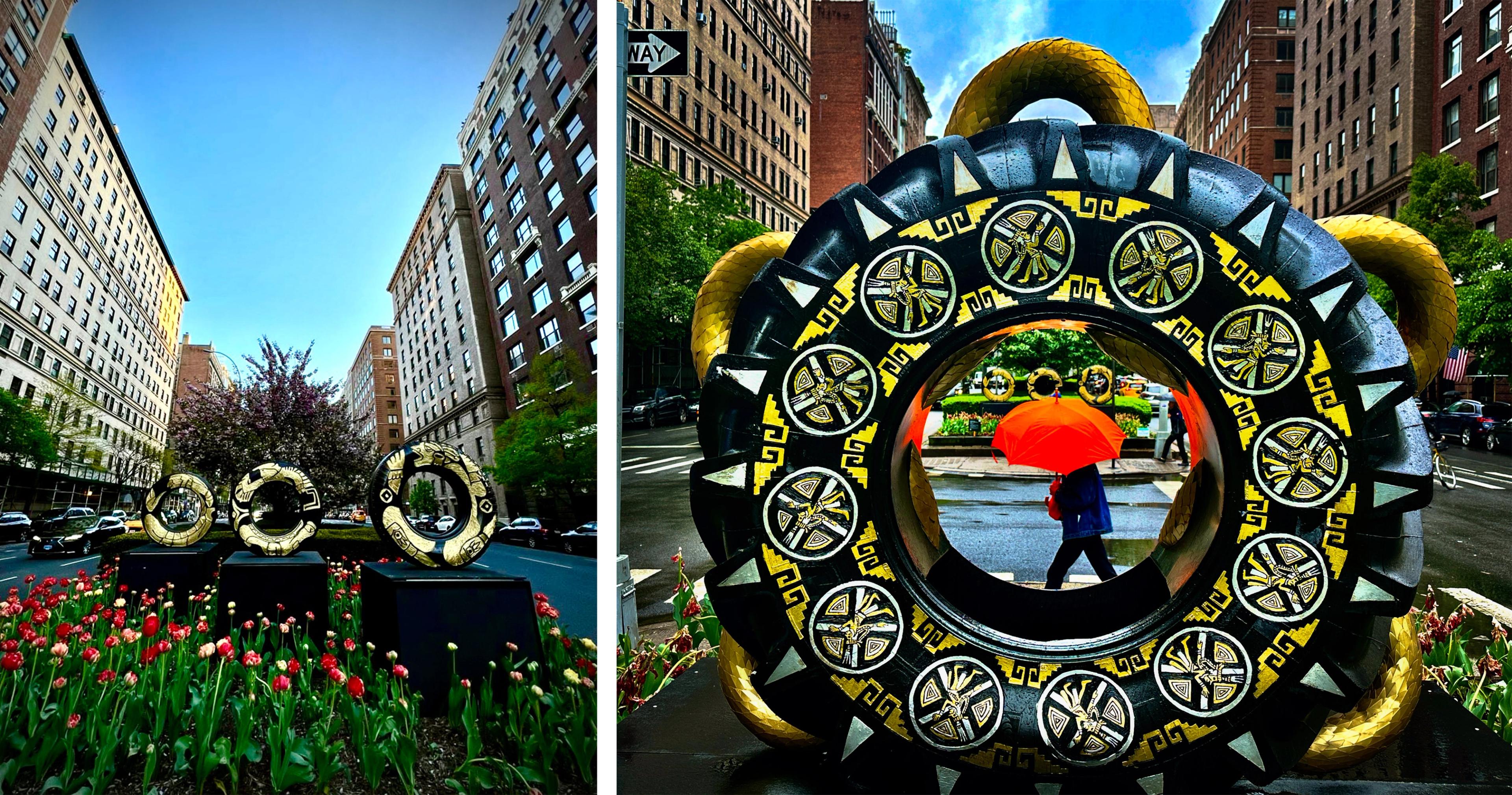 On the left, three tractor tires brightly engraved and painted in gold colors on display at Park Avenue. On the right, a tractor tire decorated in bright yellow and white geometric patterns, framing a figure walking under an orange umbrella.