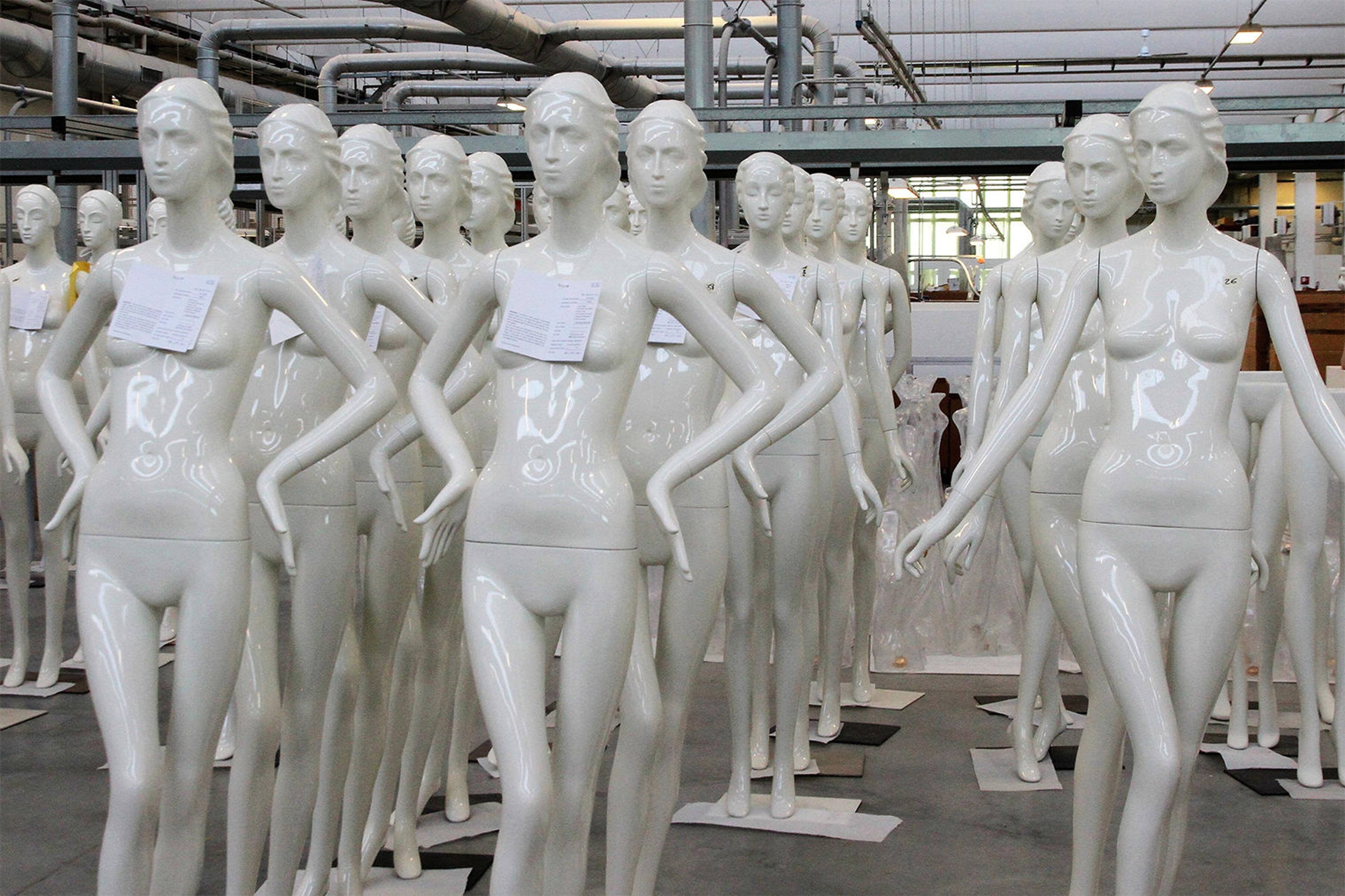 Collection of shiny white mannequins in the Bonnevari factory in Italy.