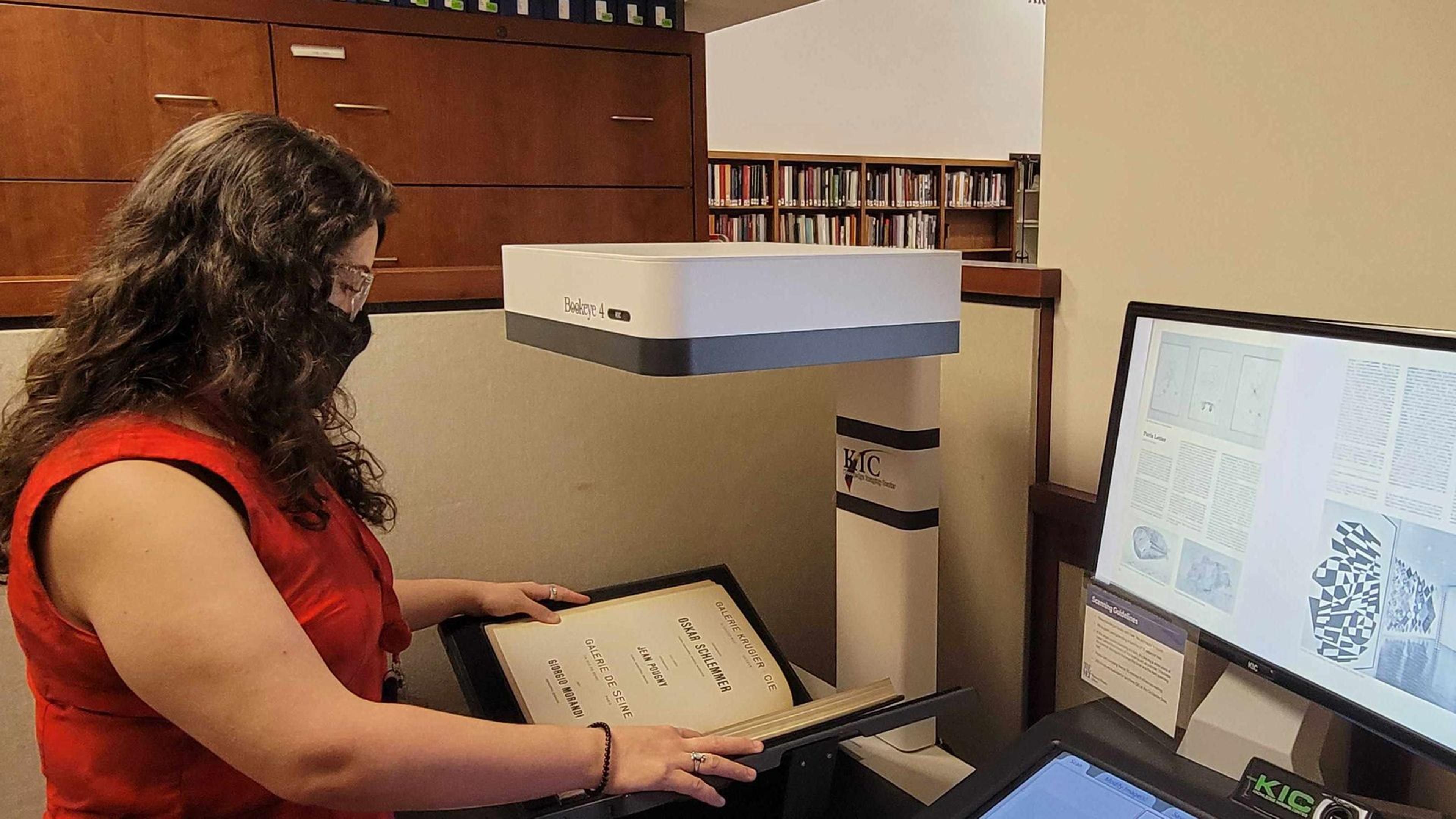 Librarian scanning a book