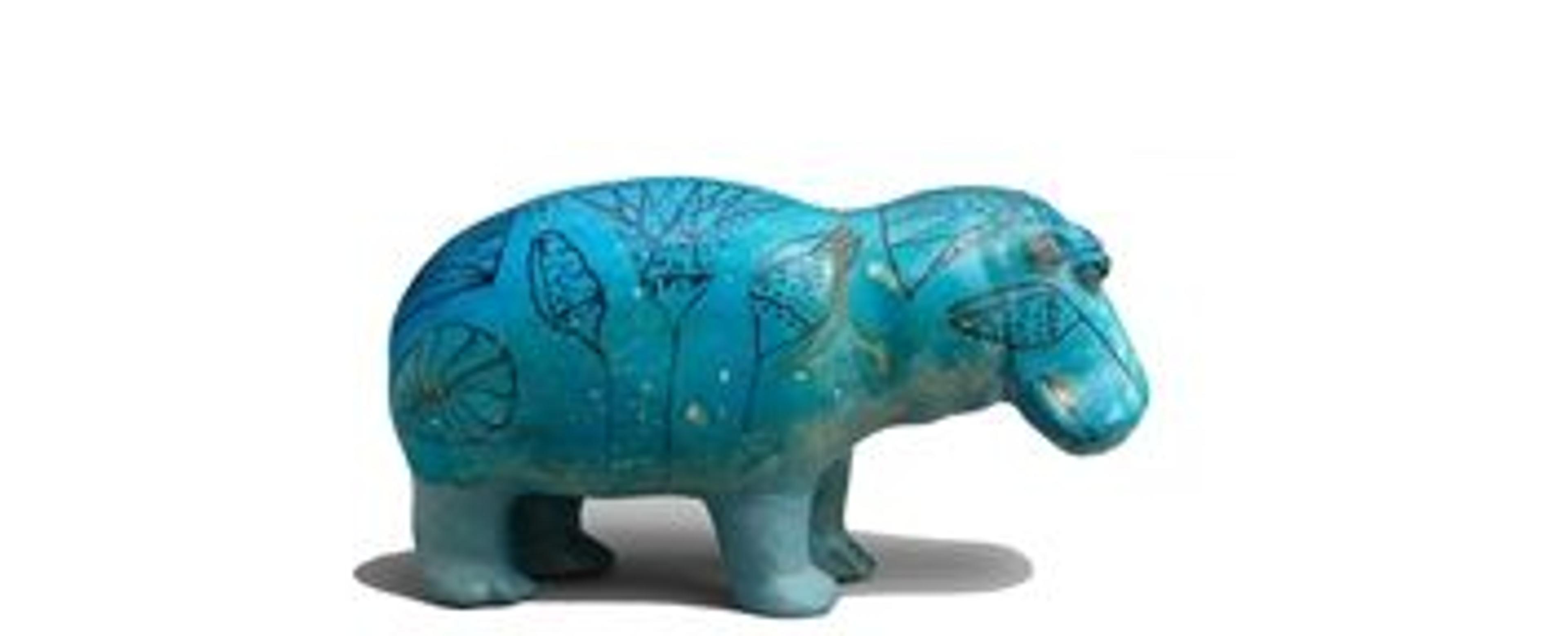 Profile view of blue ceramic hippopotamus