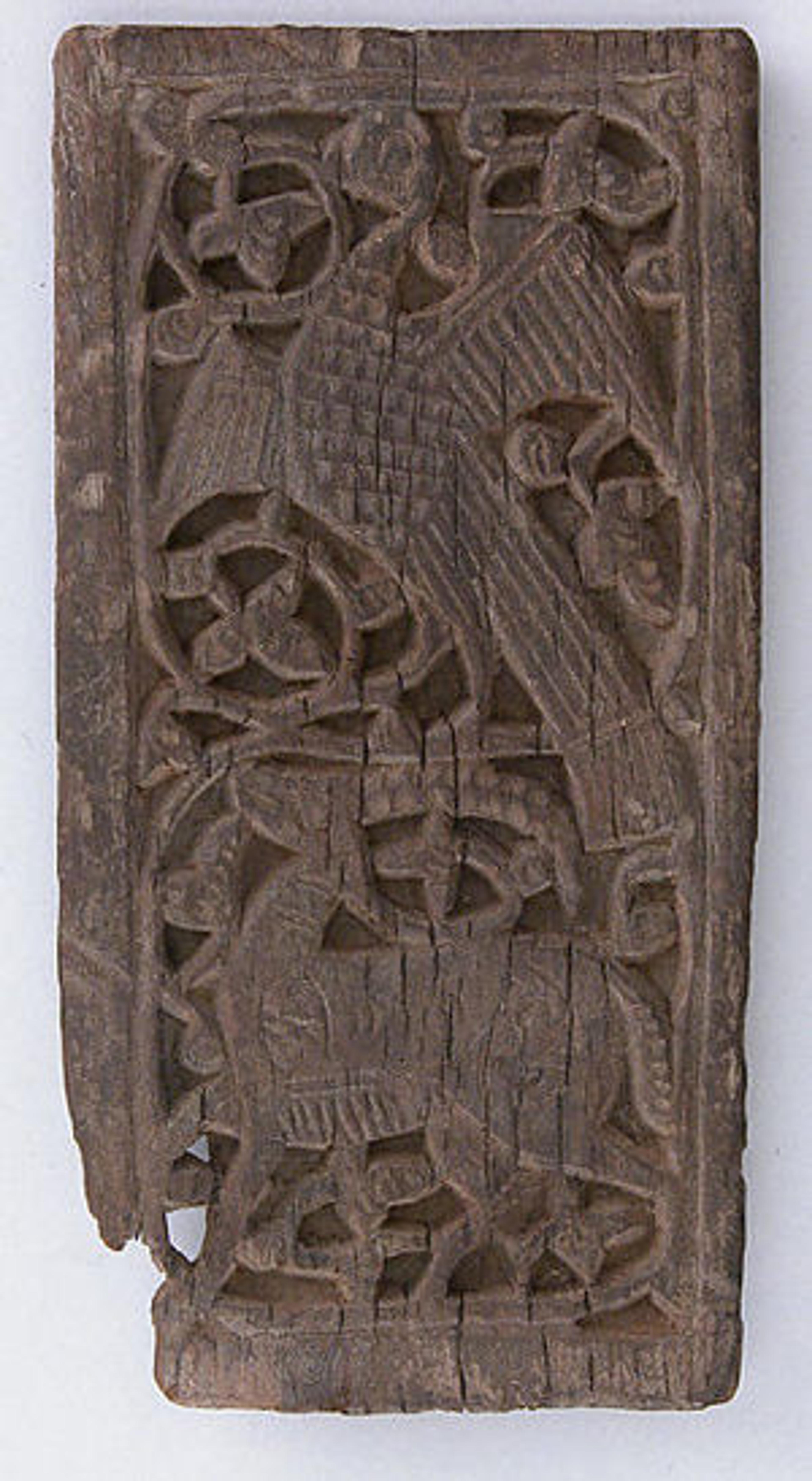 Left: Panel, 10th–12th century. Egypt. Islamic. Wood (ebony); carved; H. 13.7 cm, W. 7cm. The Metropolitan Museum of Art, New York, Rogers Fund, 1933 (33.157.3)