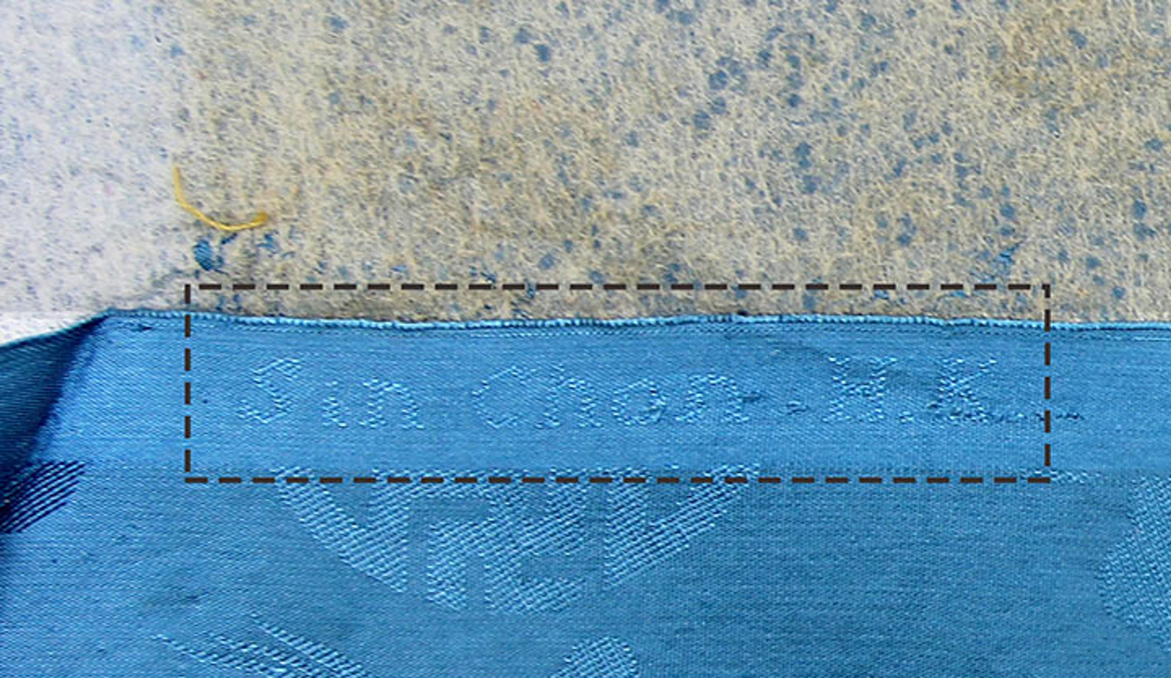 Blue fabric showing manufacturer logo 