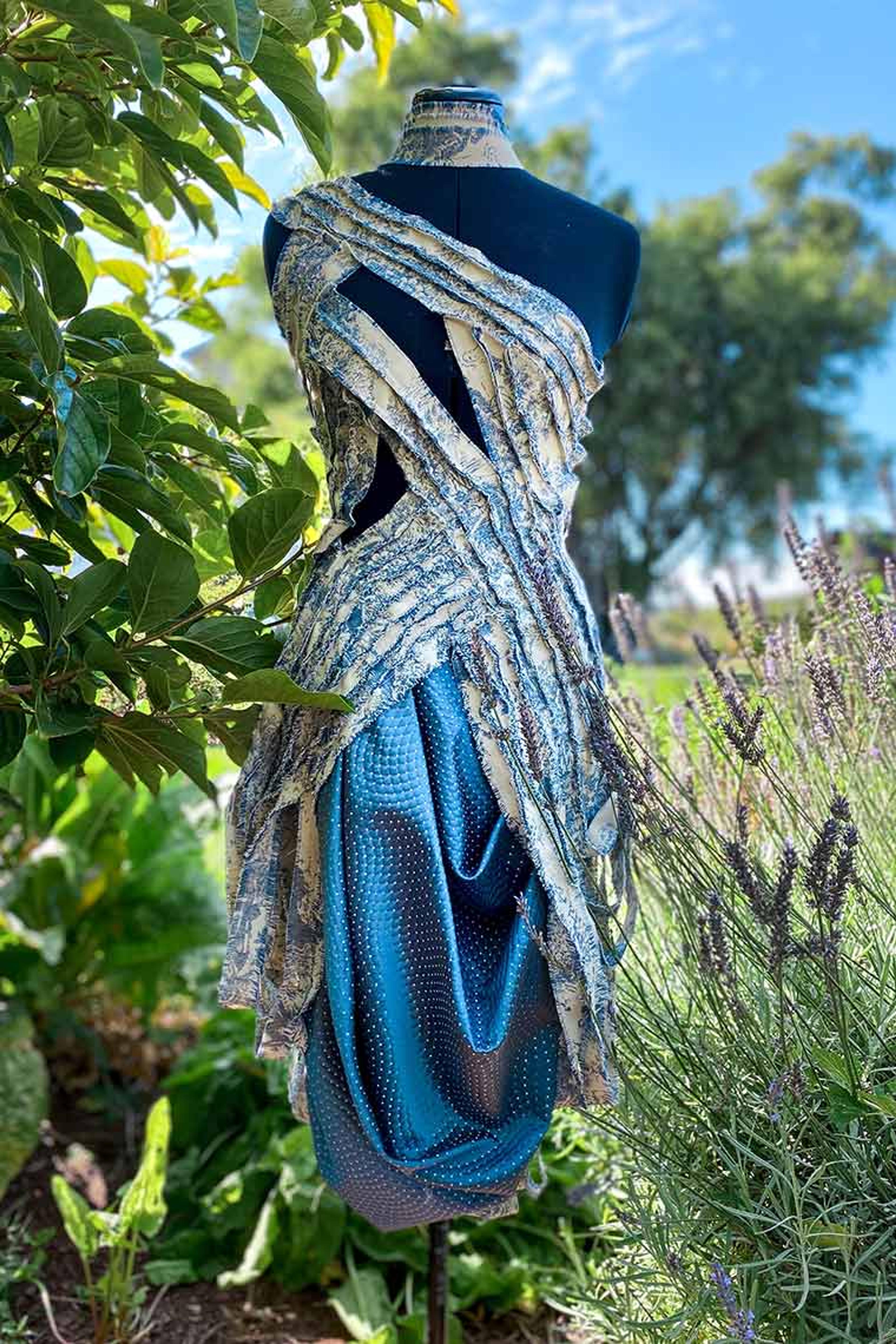 Parker Spear's blue dress design on display in nature