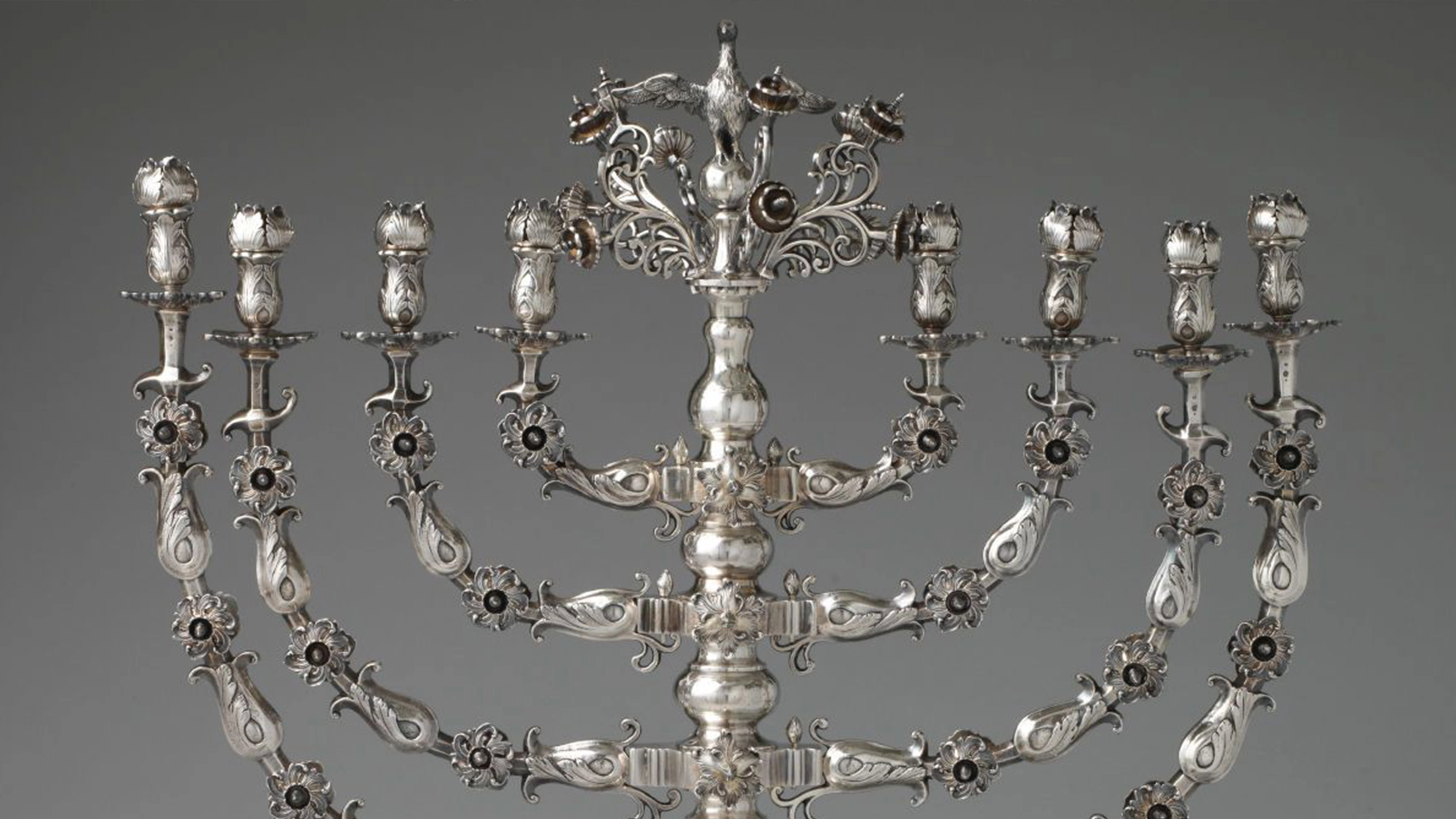 a close-up of an ornate silver menorah.