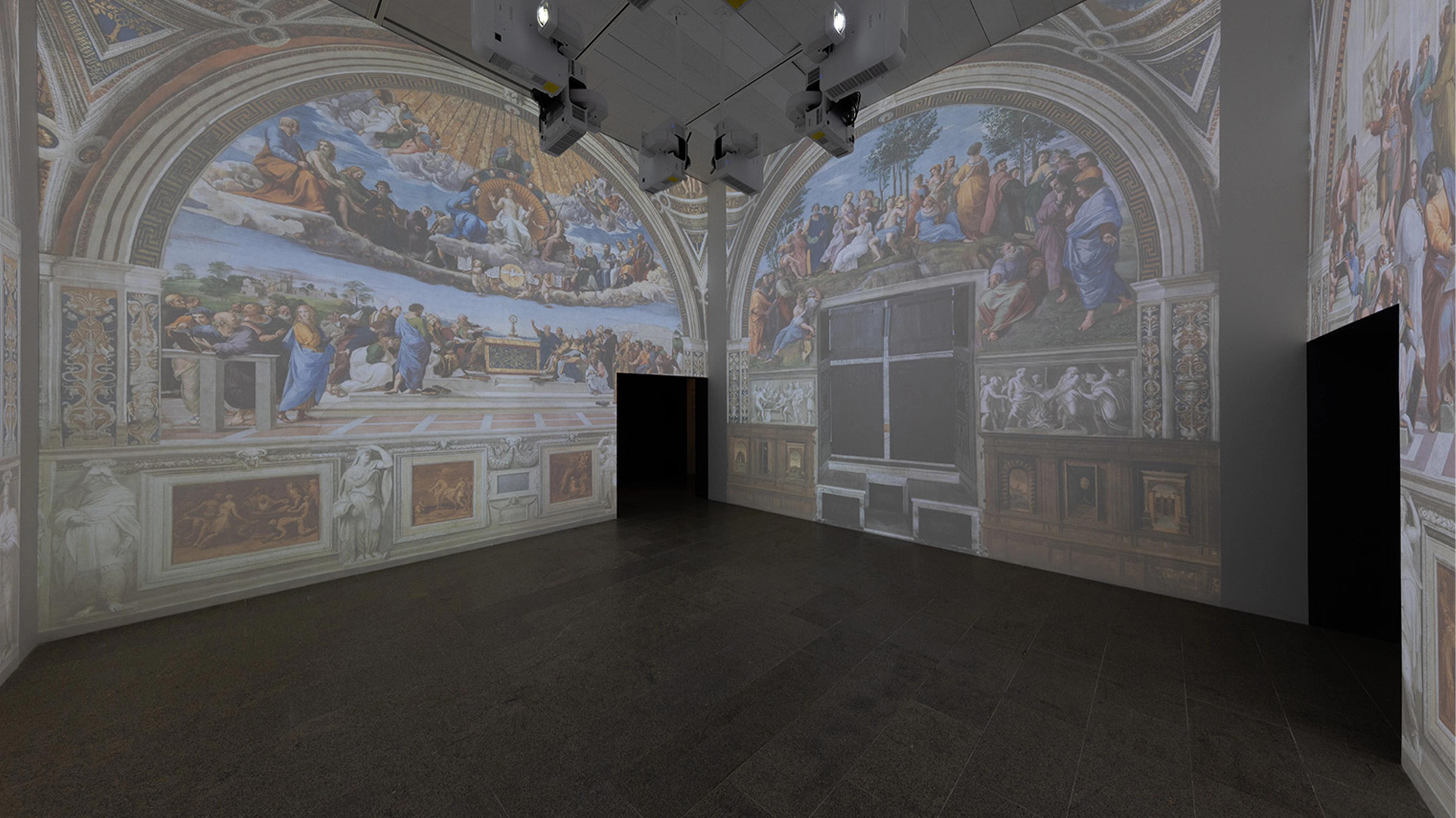 A large room displays wall projections of renaissance-style frescoes featuring figures in dynamic poses and vivid colors.
