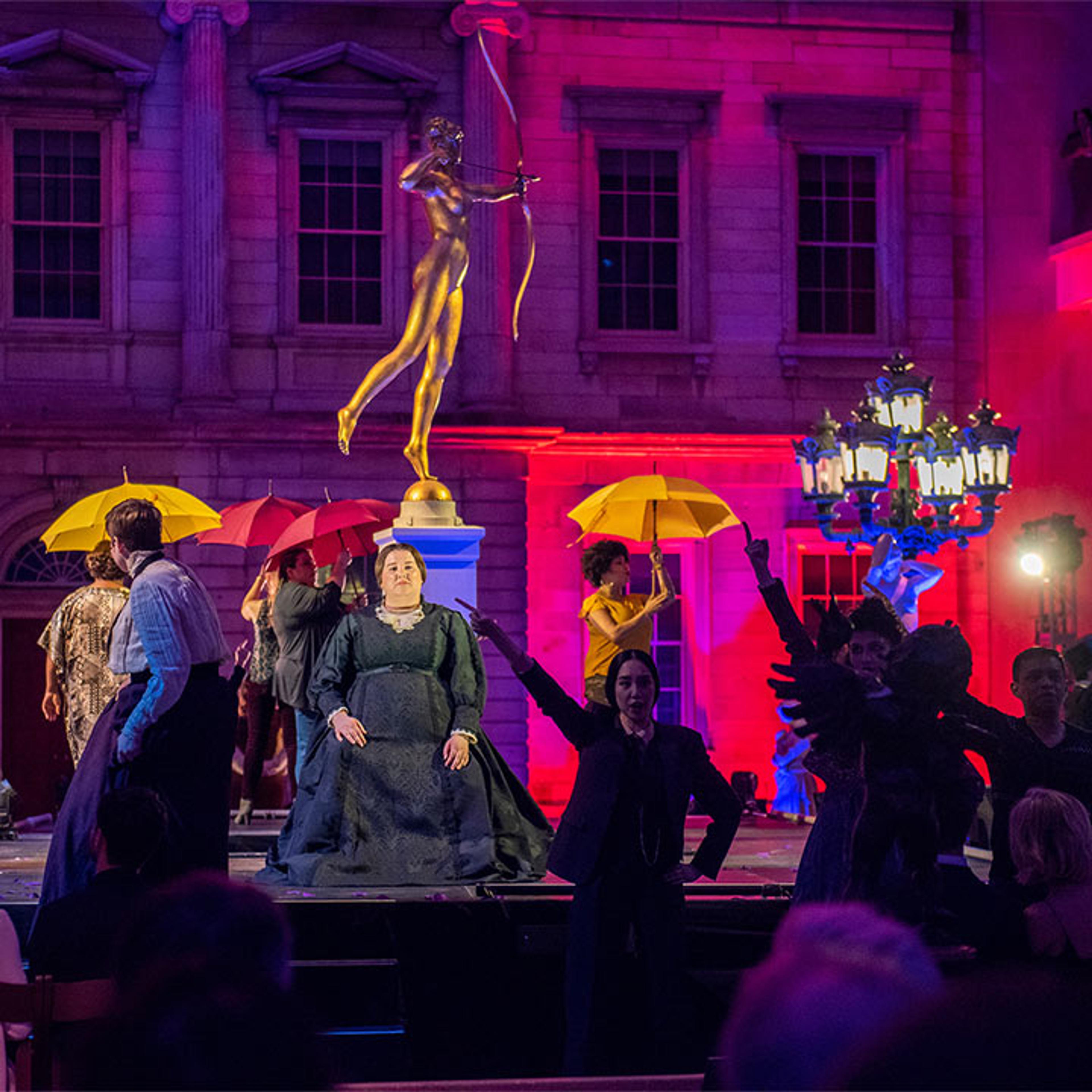 An opera is performed in the American Wing court