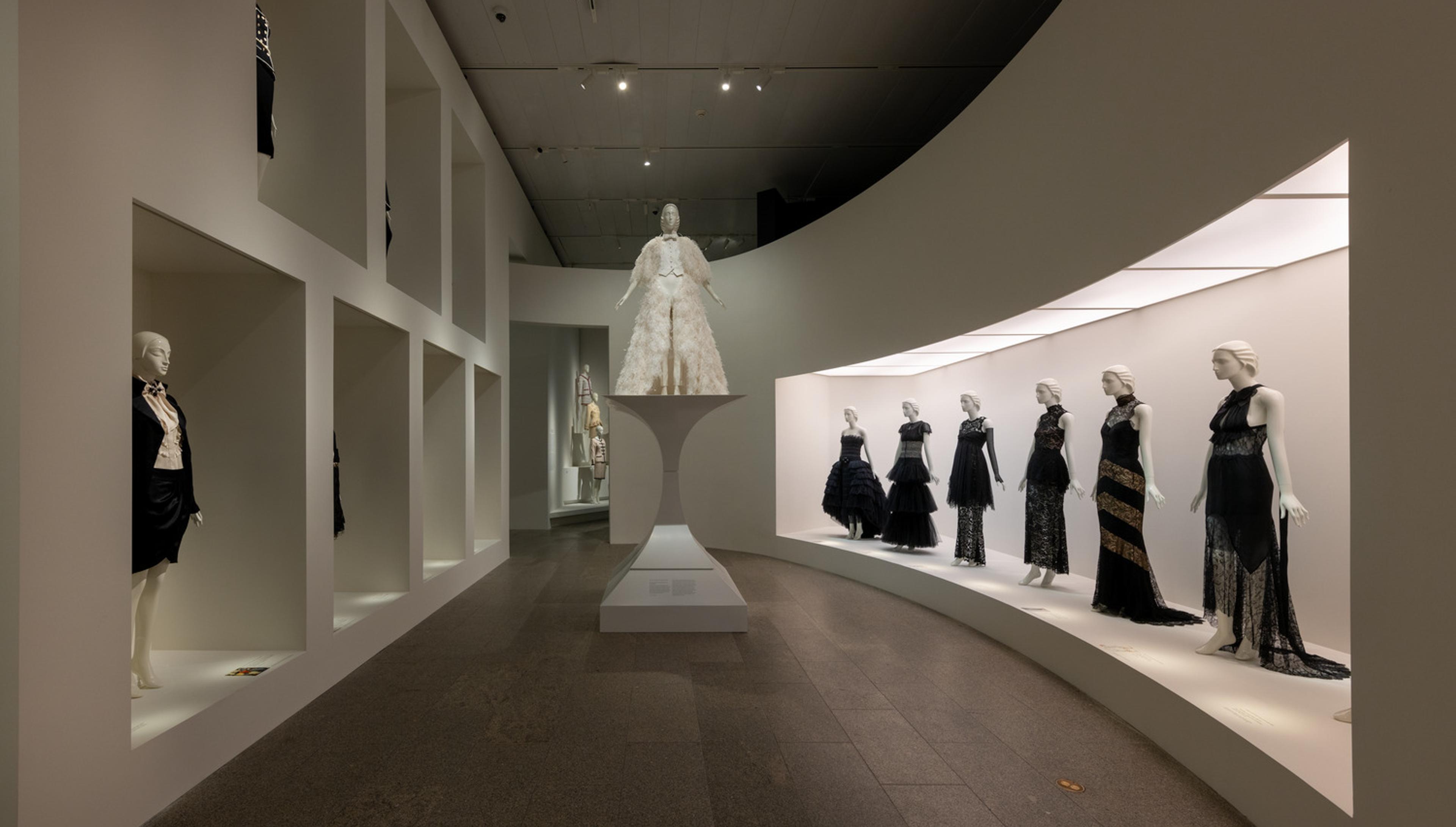 Mannequins wearing garments designed by Karl Lagerfeld on display in The Met's galleries.