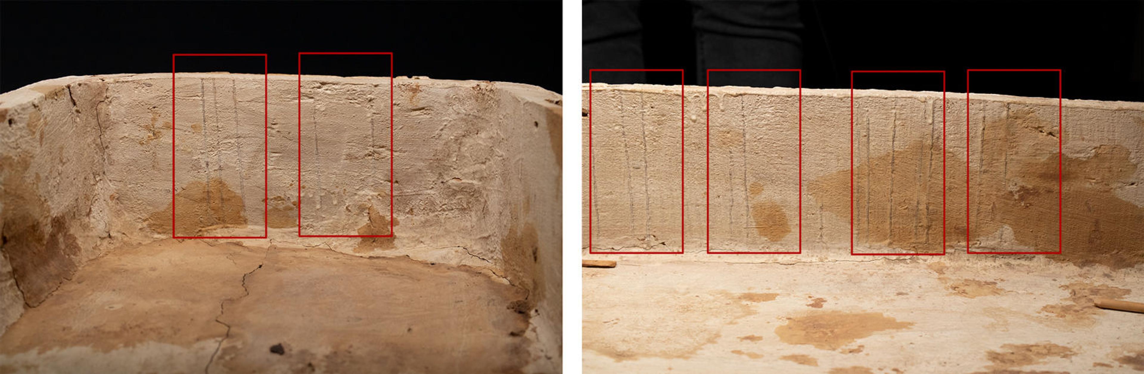 The inside of a wooden coffin that has been painted white, with drips down the sides that are marked out with red rectangles.