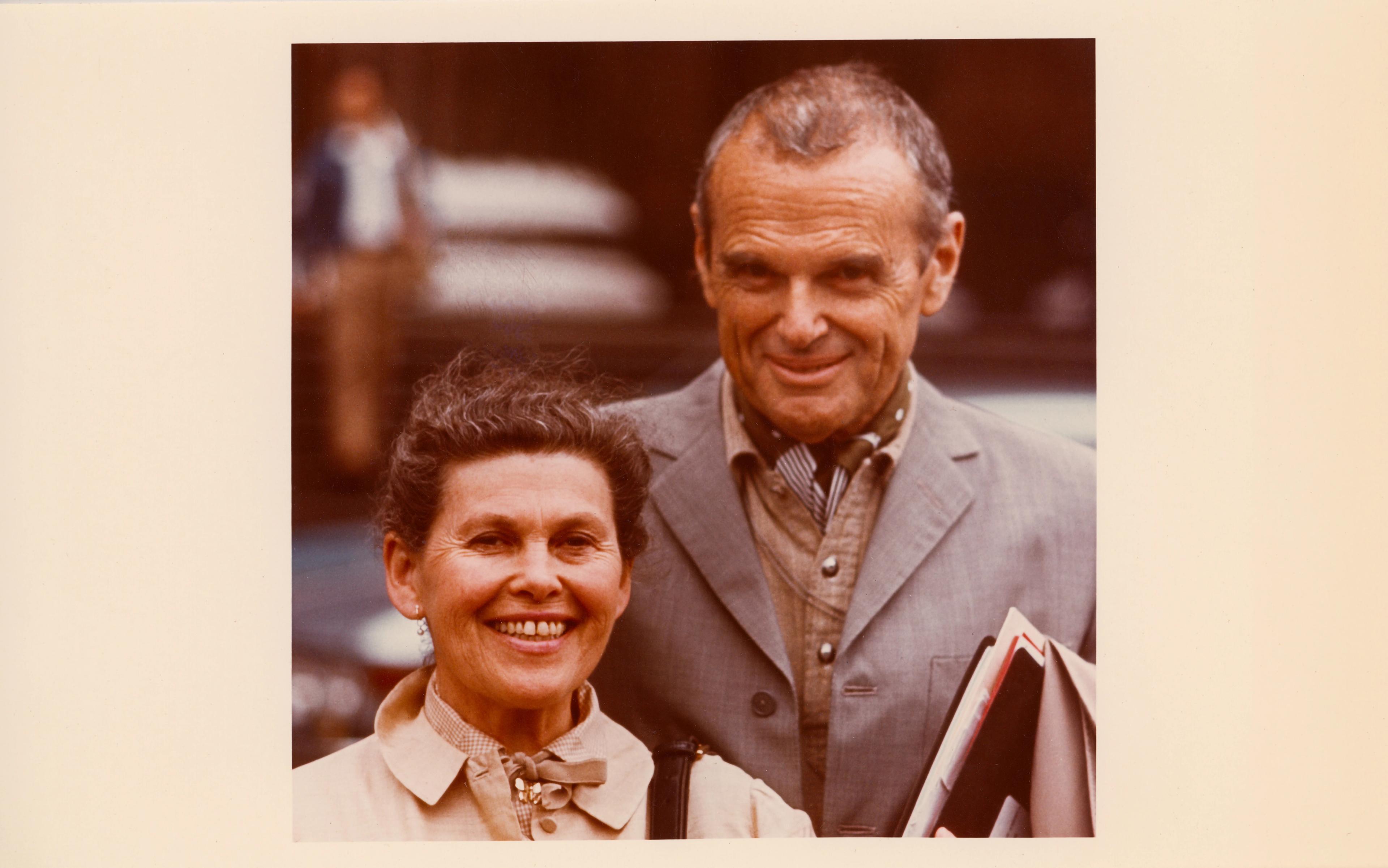 Sepia-toned photograph of a smiling Ray and Charles Eames