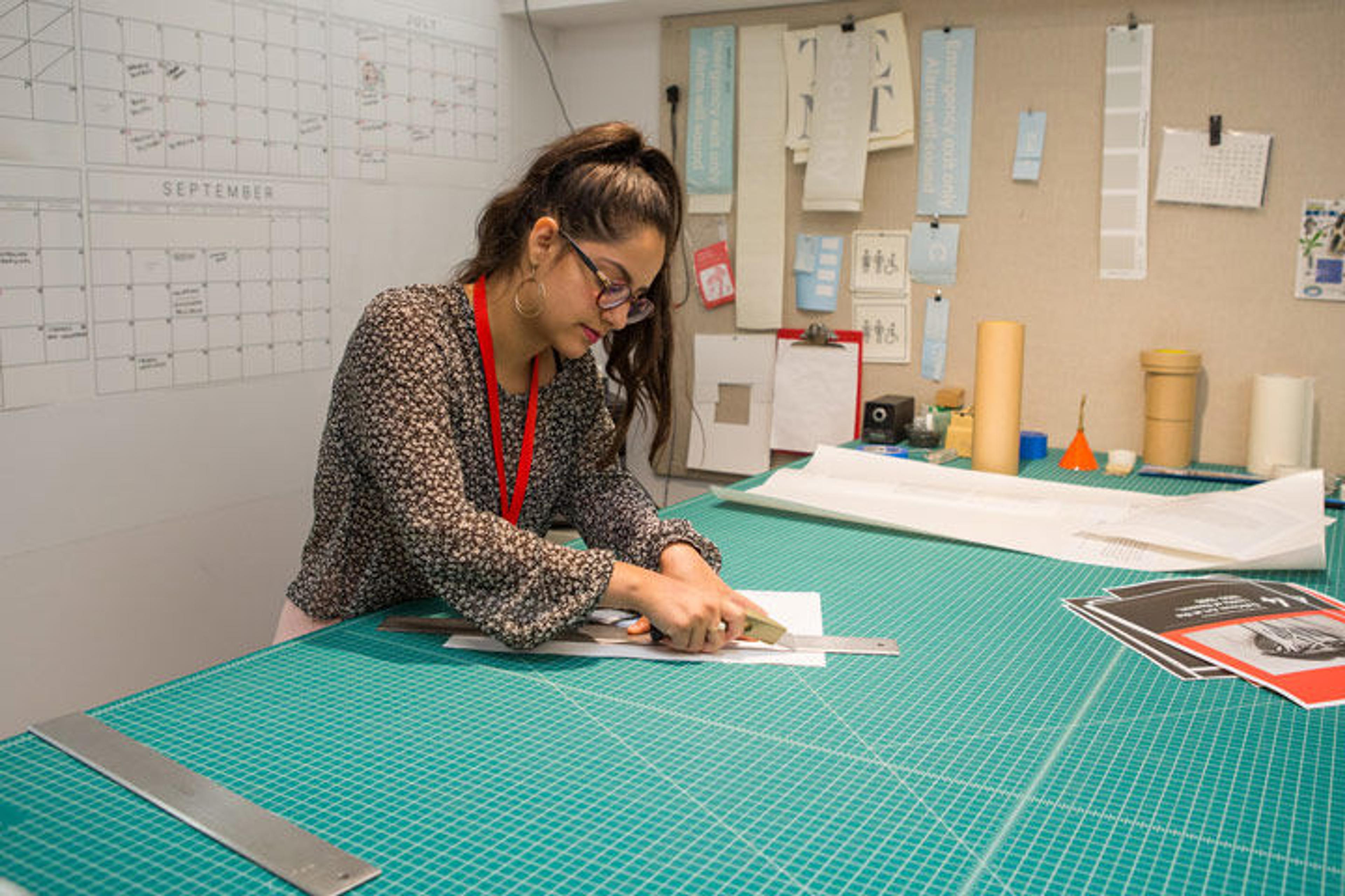 A student at work at a drafting table