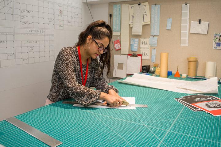 A student at work at a drafting table