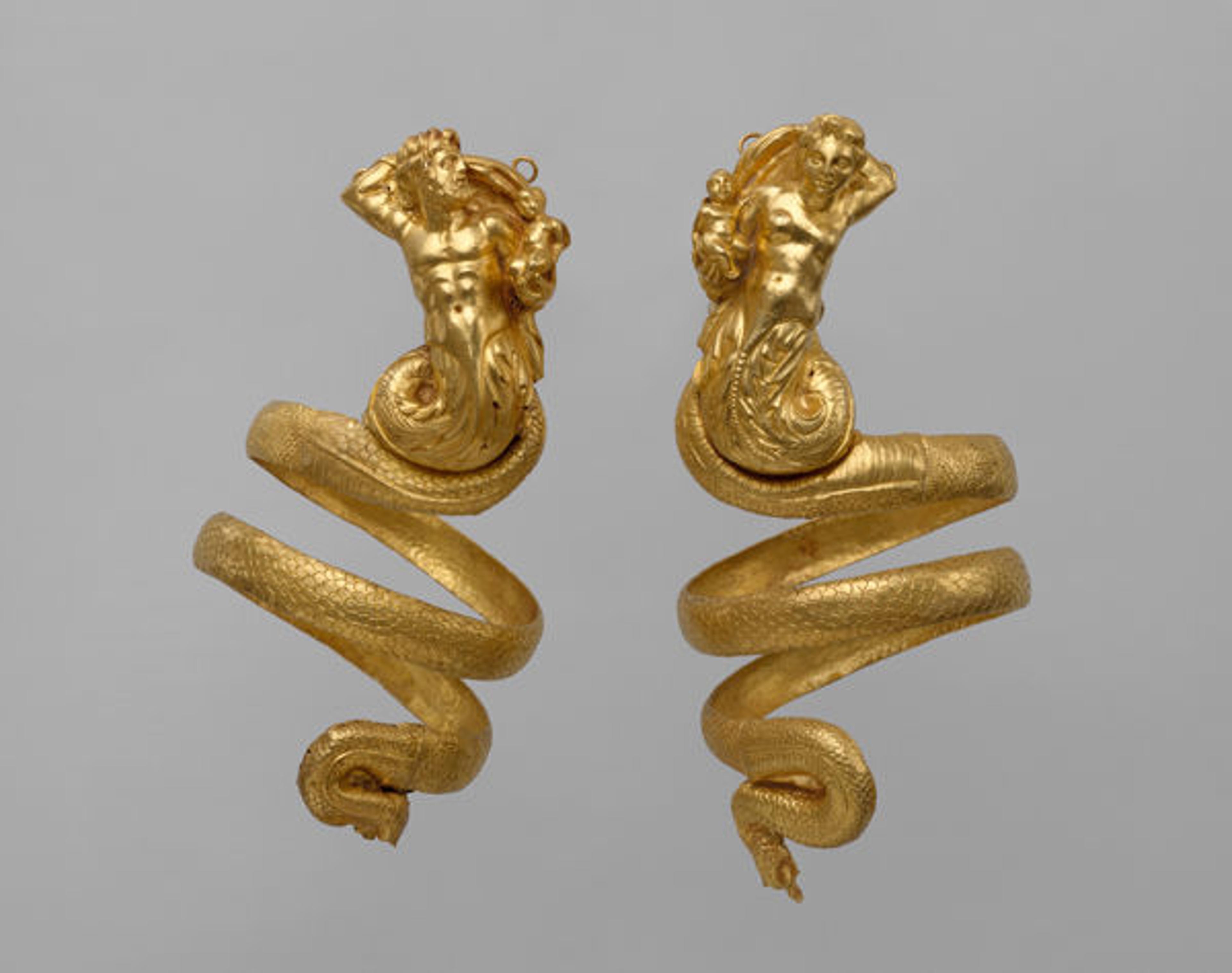 Pair of gold armbands, ca. 200 B.C. Greek, Hellenistic. Gold; Overall: 10 7/16in., 0.4lb. (26.5cm, 0.2kg) Other (height-triton armband): 9 13/16in. (25cm) Other (height-tritoness armband): 10 7/16in. (26.5cm). The Metropolitan Museum of Art, New York, Rogers Fund, 1956 (56.11.5, .6)