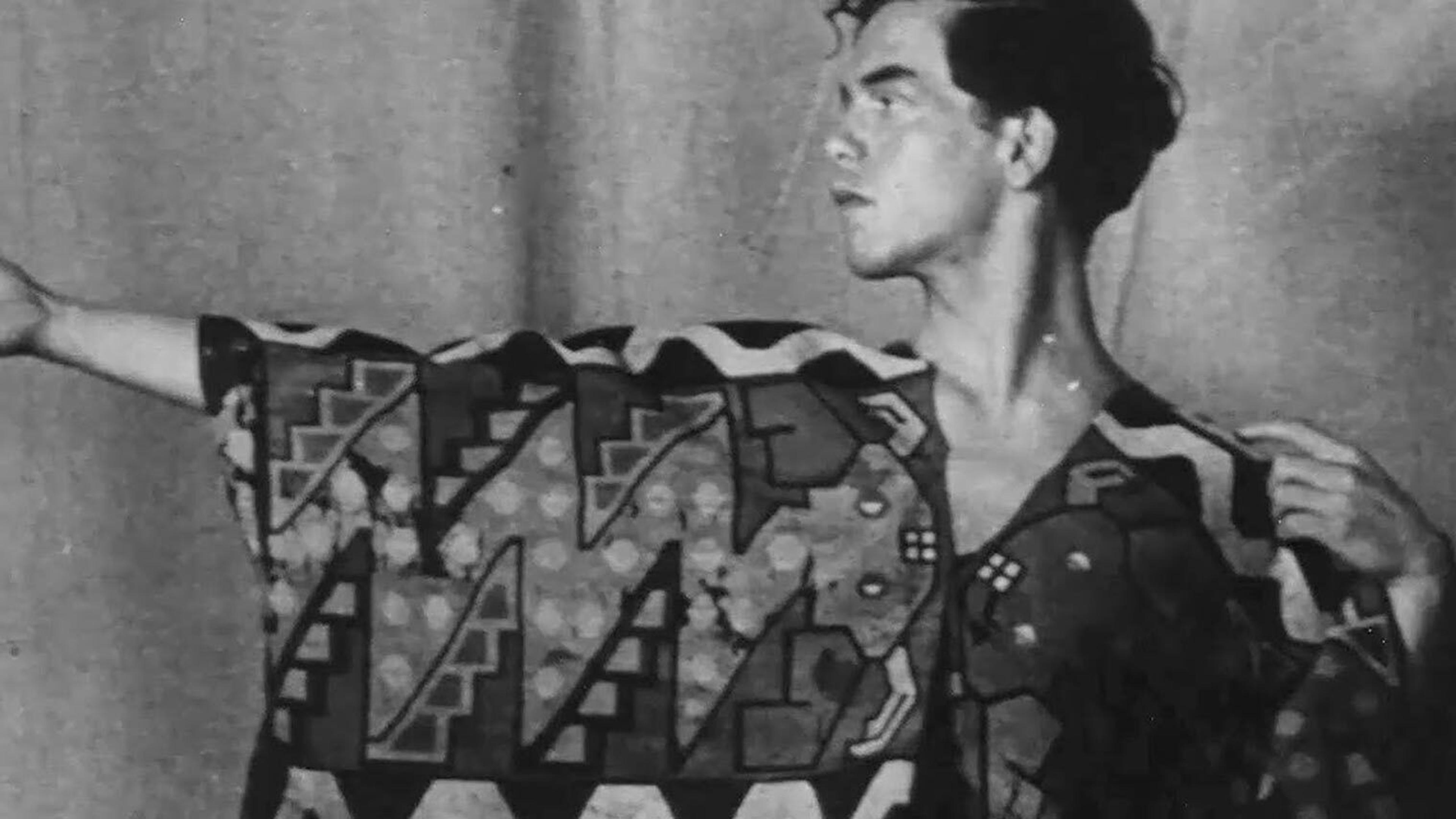 A black and white image of a man wearing an ornate robe