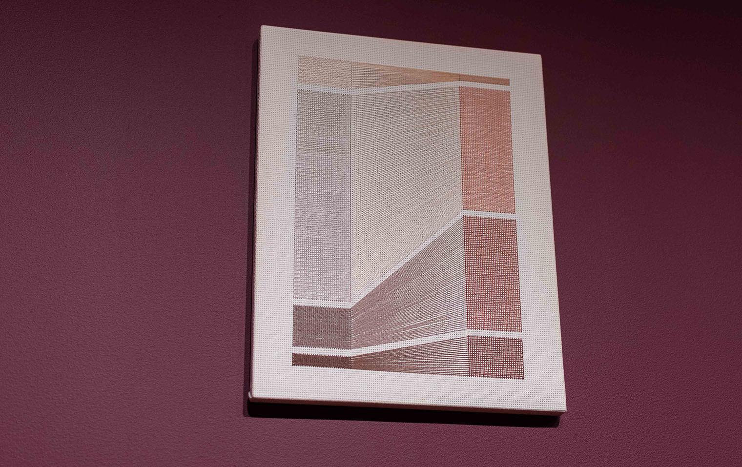 Embroidered data visualization on a white canvas