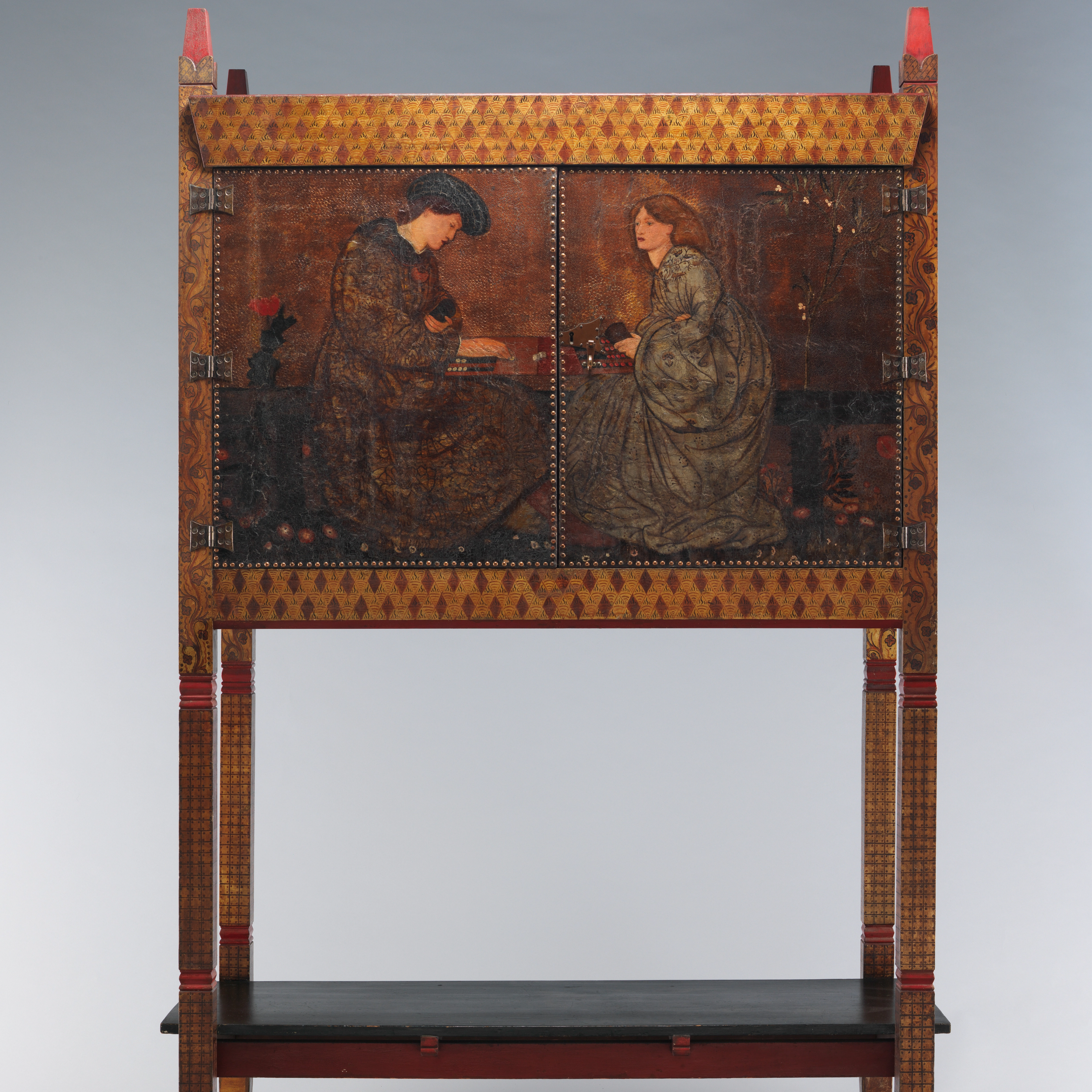 Cabinet painted with a scene of two backgammon players.