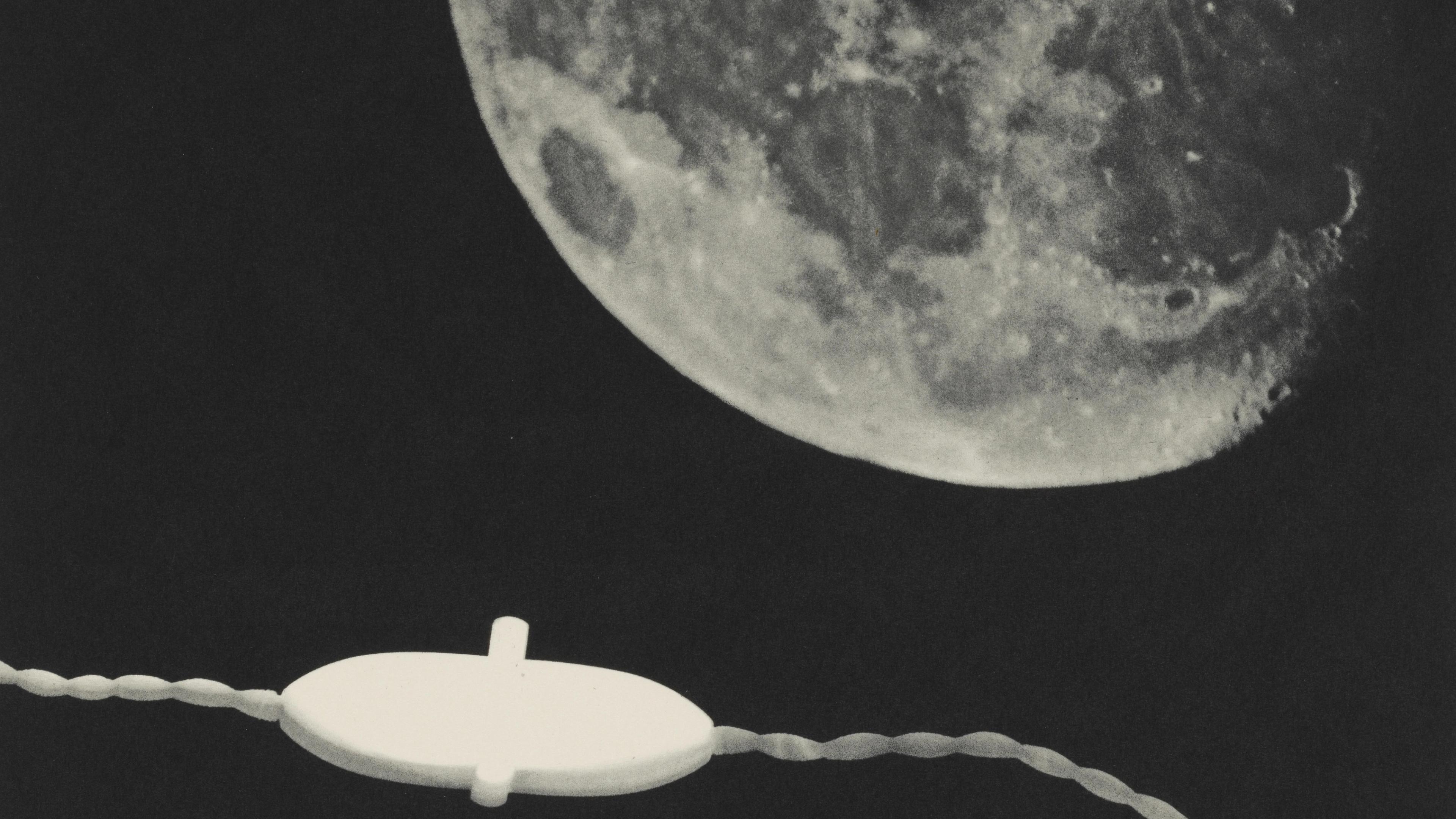 A close-up of the Moon's surface shows intricate details against a dark sky. A white electrical cord runs horizontally with a switch in the foreground.