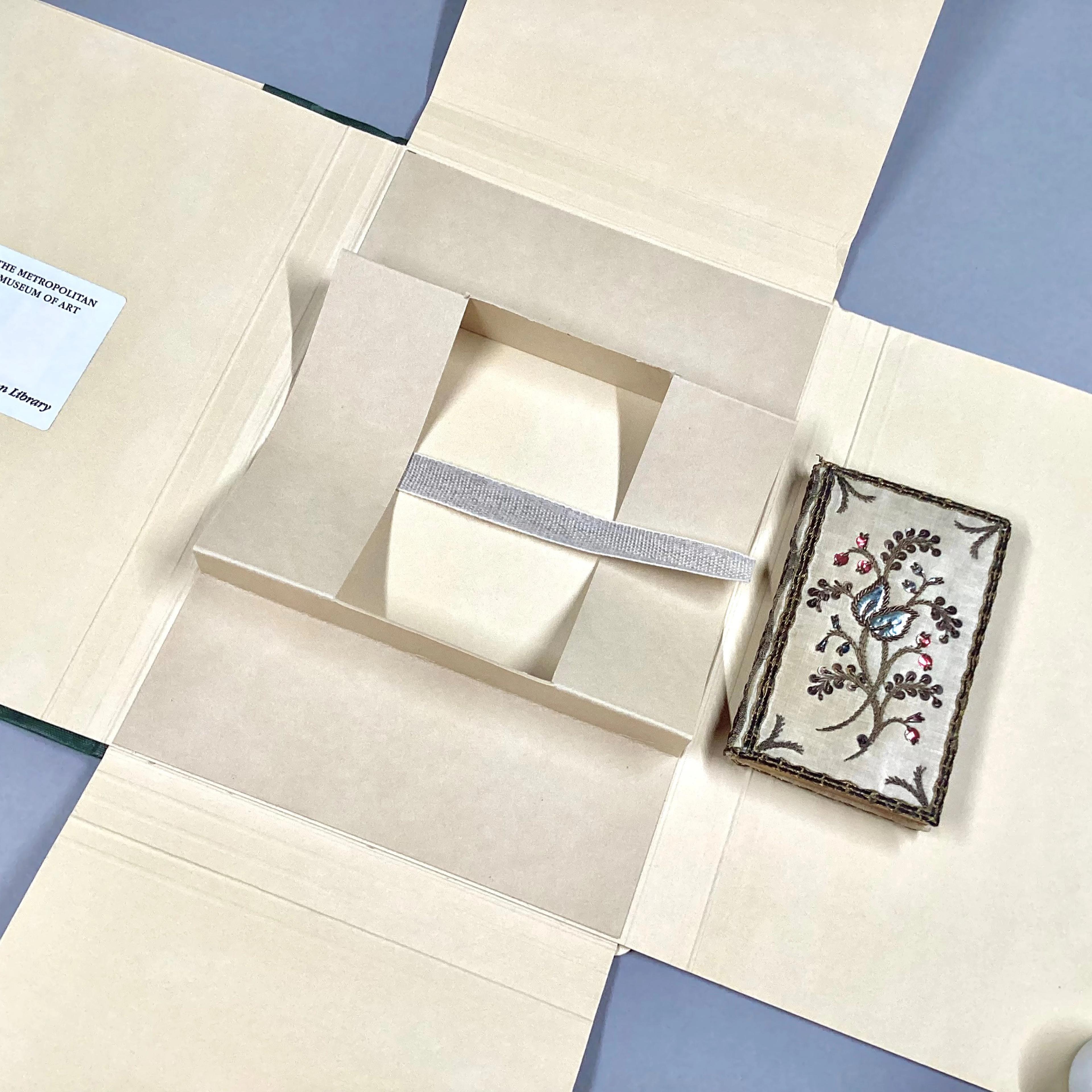 Unfolded box for holding a book.