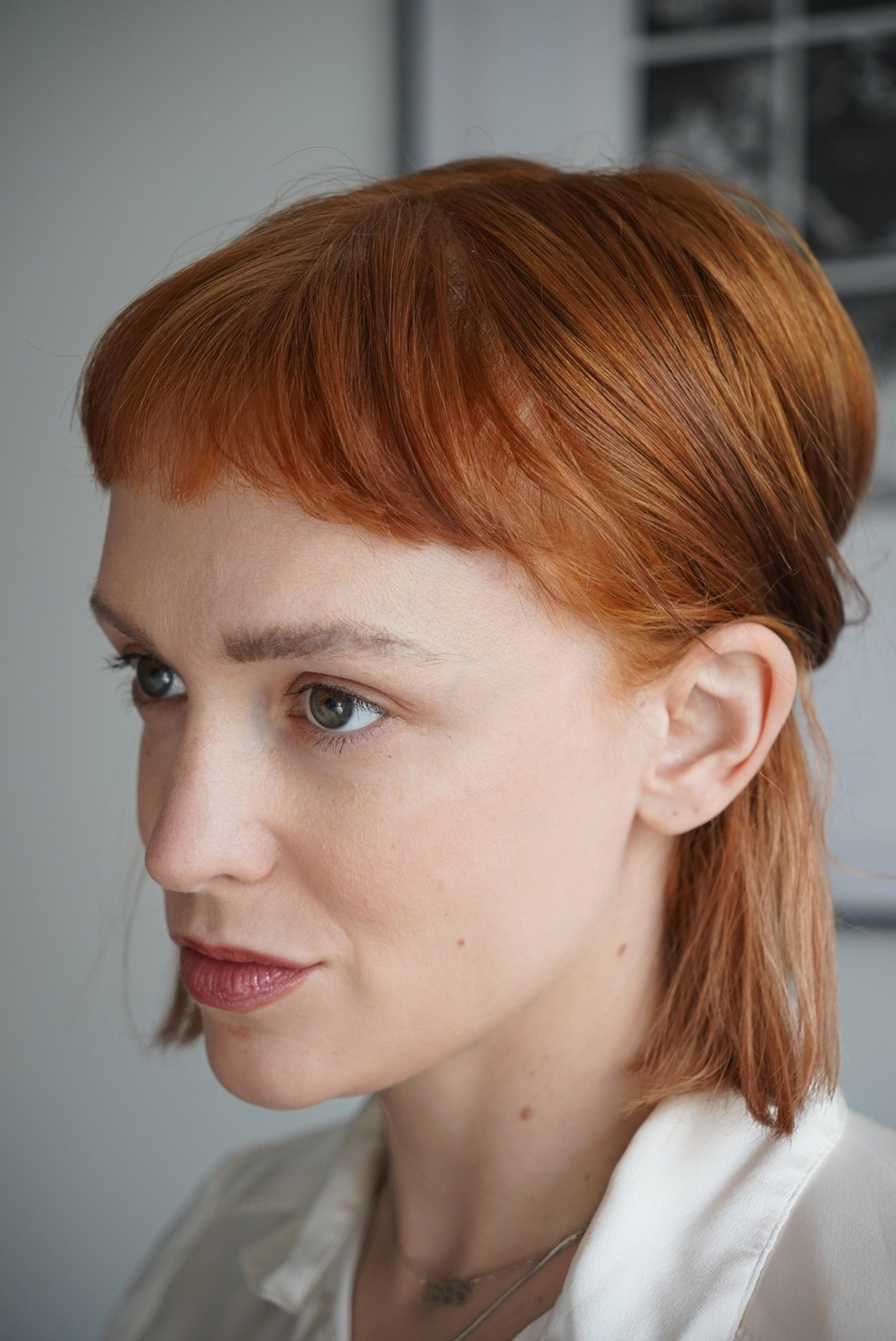 Emily Long in profile facing left