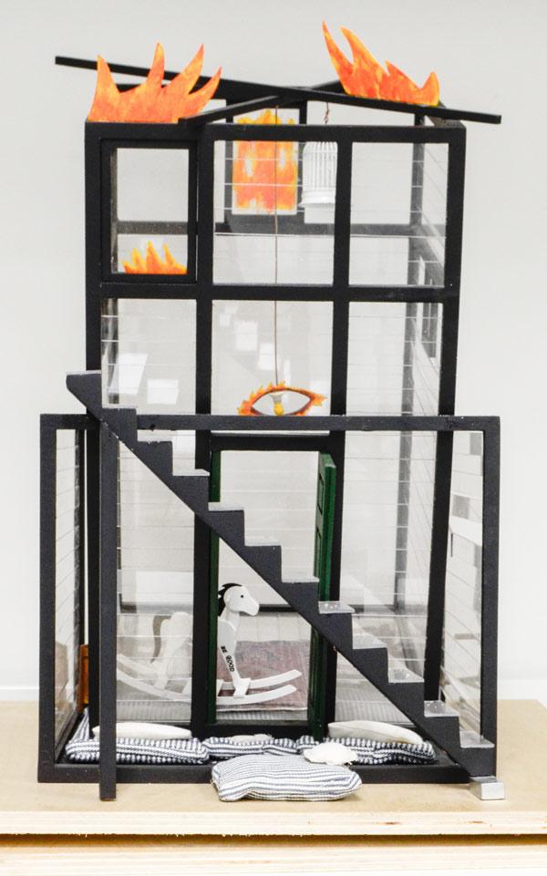 A maquette for Fallujah, a large-scale sculpture by Siah Armajami at the Walker Art Center in Minneapolis, serves as a reminder of the houses and lives that were destroyed during the Second Battle of Fallujah in November 2004. The work references Picasso's Guernica, as well as the hit 1950s song "Johnny B. Goode" by Chuck Berry. Armajani Siah (Iranian, b. 1939). Fallujah 2004, 2004. Wood, paint, plexiglass, cloth, metal and copper wire; 16 1/2 x 10 11 3/4 in. (41.9 x 25.4 x 29.8 cm). The Metropolitan Museum of Art, New York (2014.538)