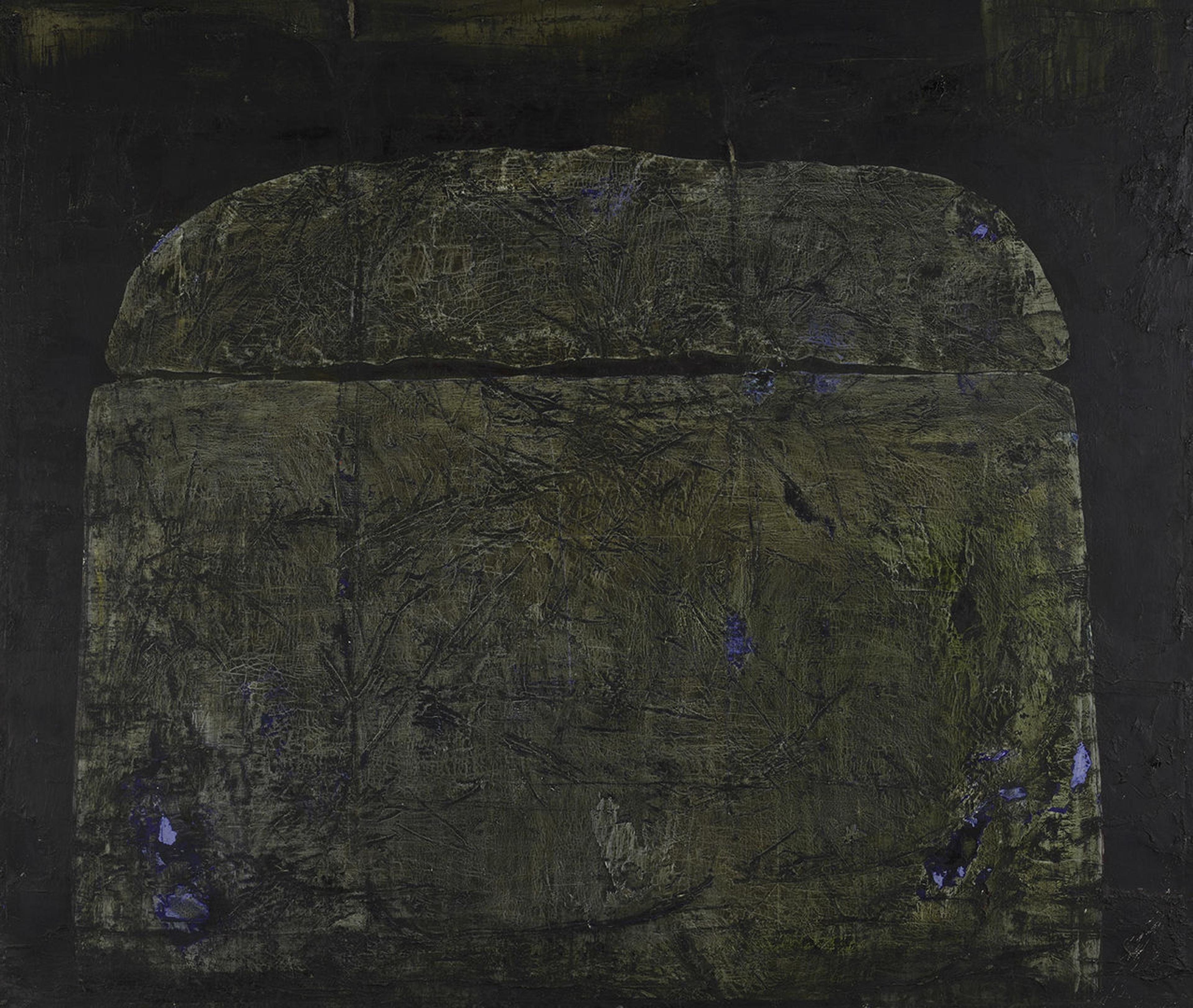 An imposing and ambiguous mound centrally positioned against a dark backdrop.