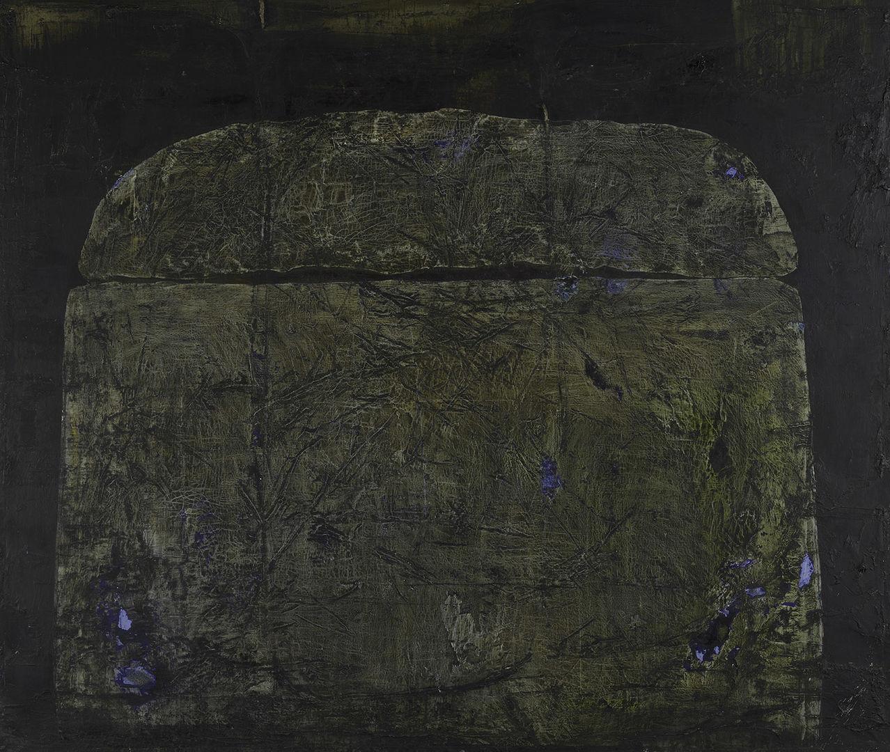 An imposing and ambiguous mound centrally positioned against a dark backdrop.