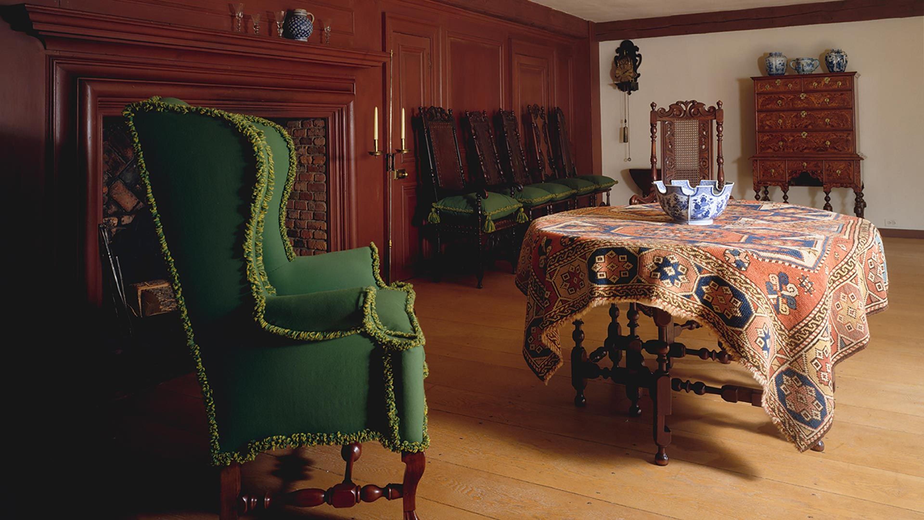 A cozy room with a sitting chair and table