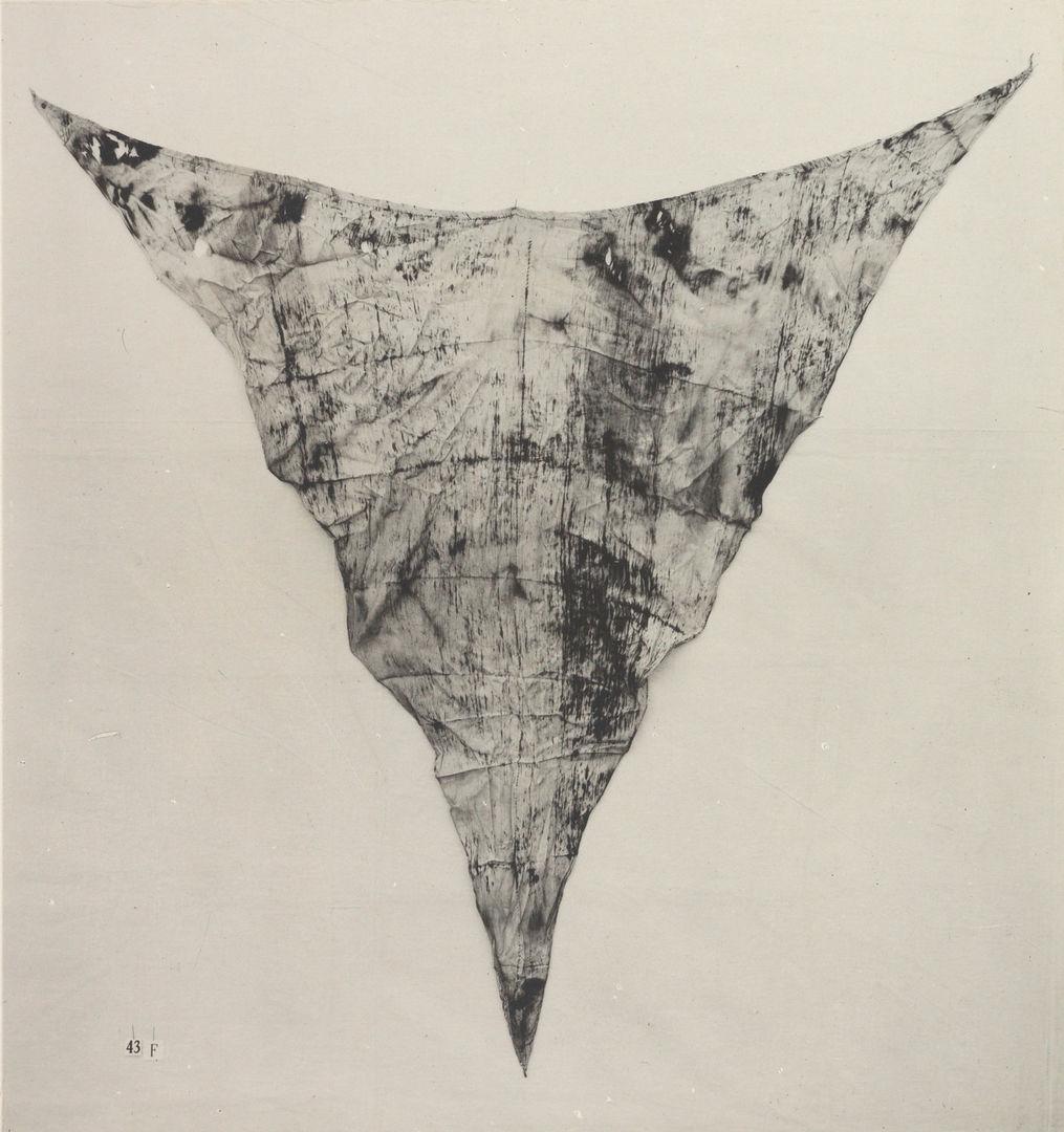 Triangular piece of cloth, worn as underwear. Creases from where it was folded in antiquity are still visible.