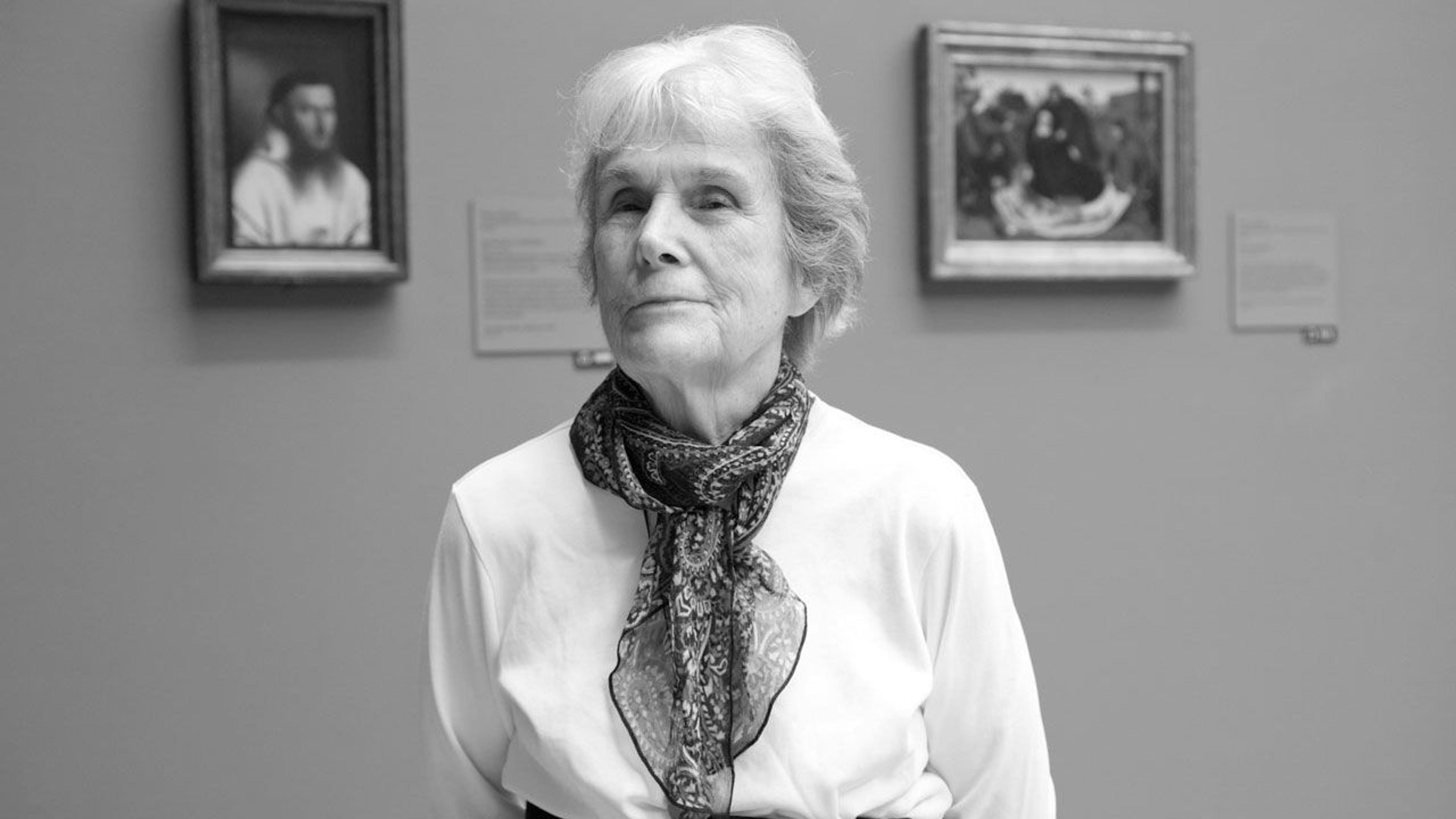 Black and white photograph of Edie Watts in The Met galleries
