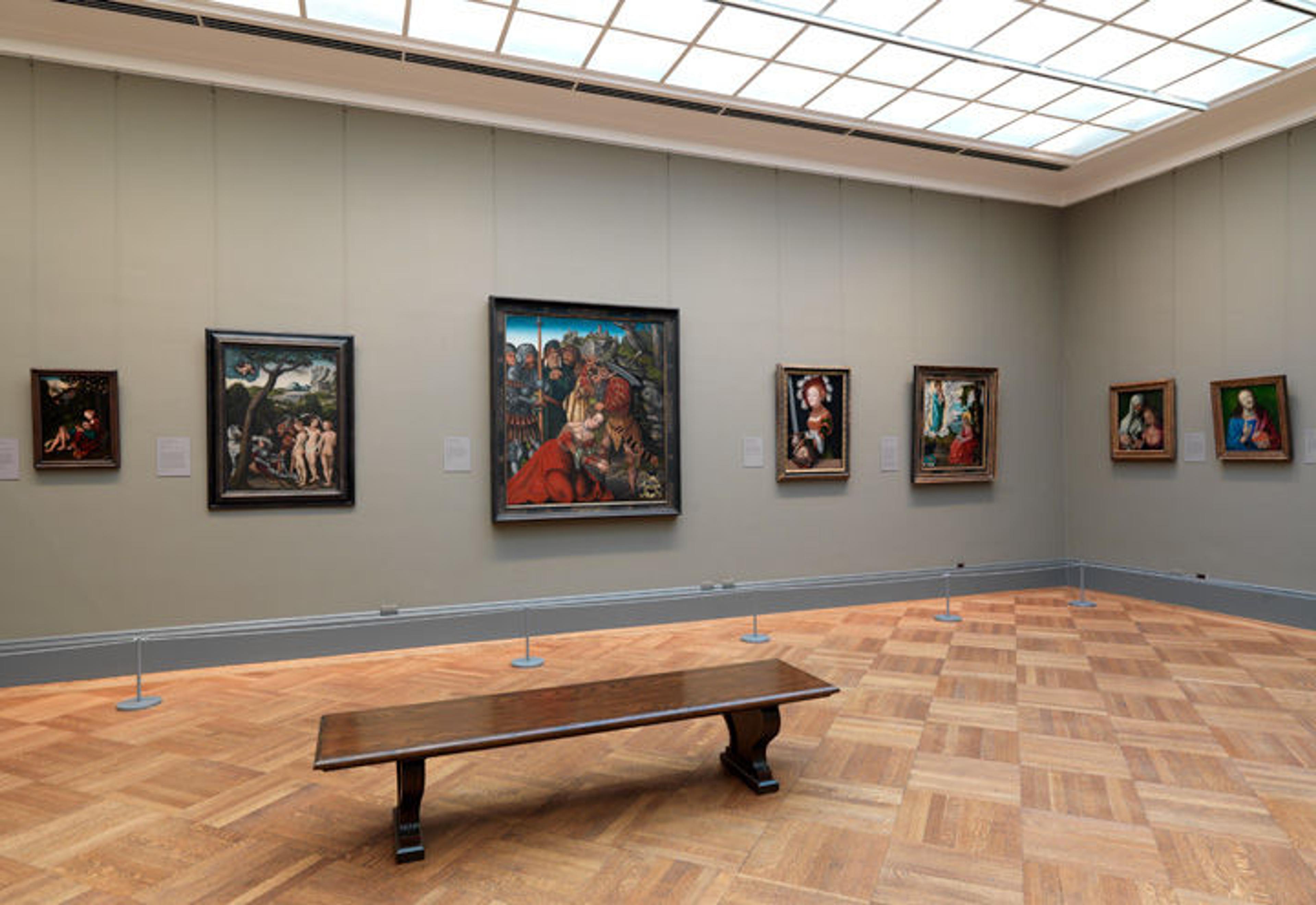 View of a gallery of European paintings illuminated by skylights
