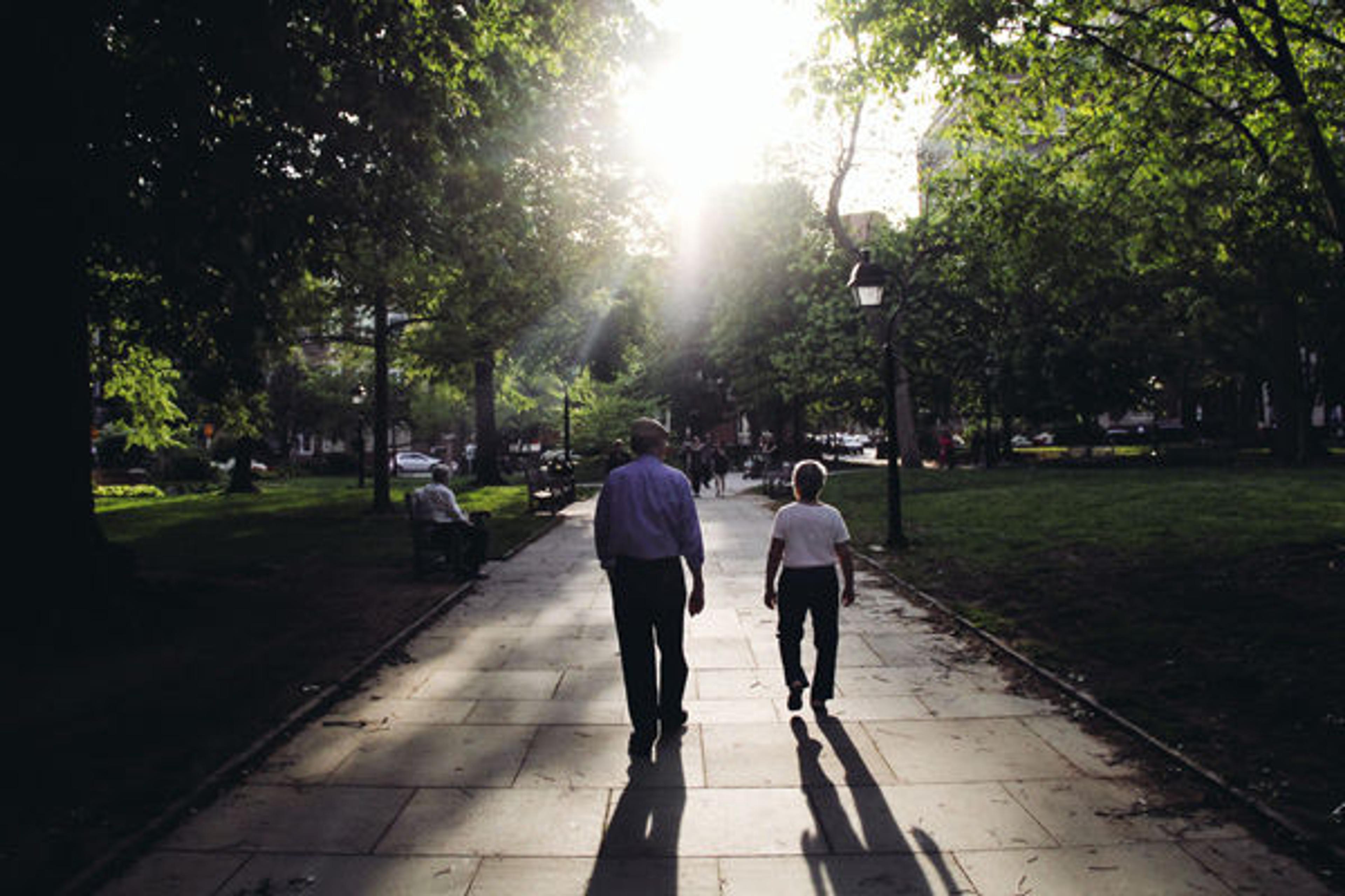 Two people walking down a path